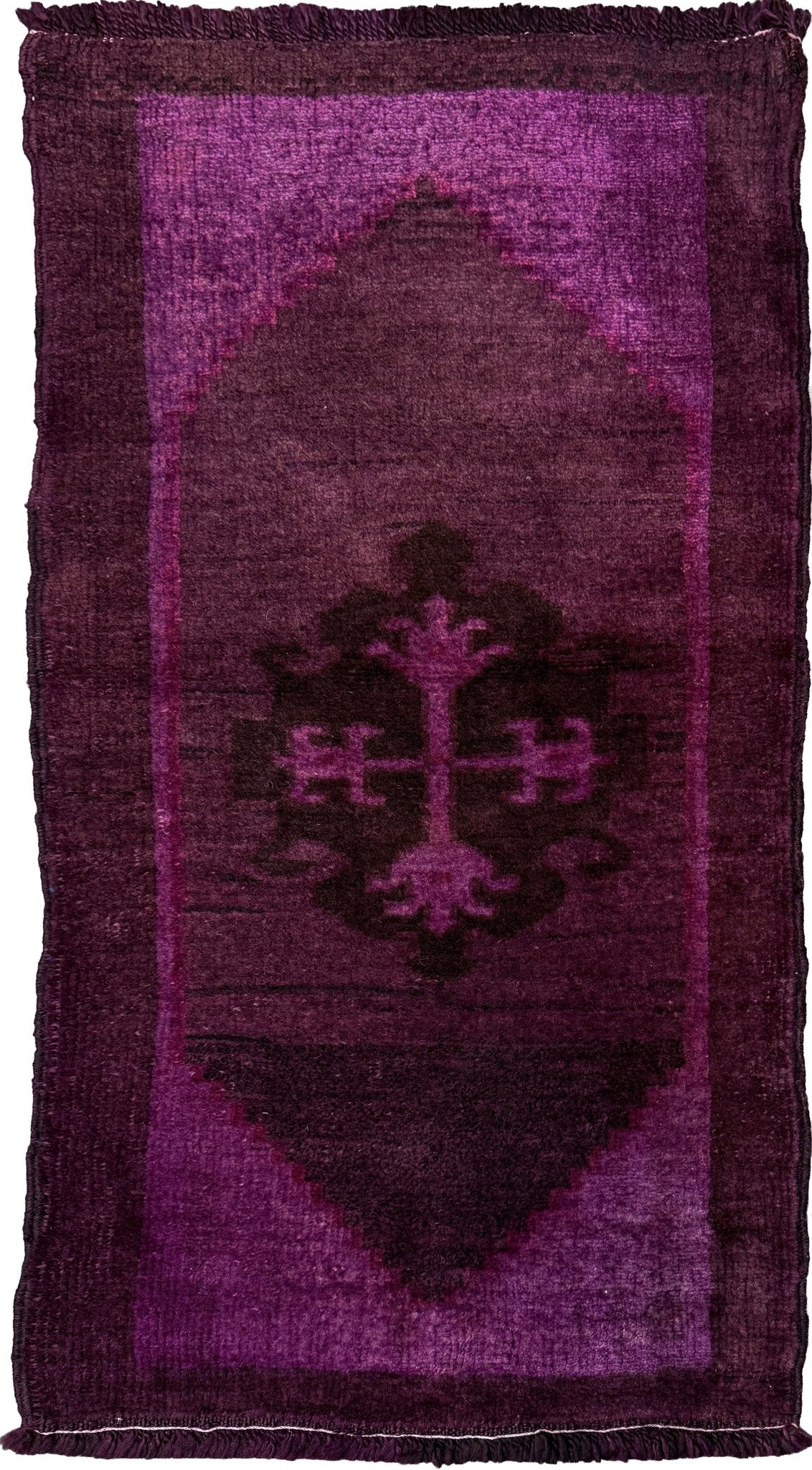 Vintage Turkish overdyed Yastik rug in plum, aubergine, and magenta purple with a shadowed black medallion. Hand-knotted wool, 19x38 inches. One-of-a-kind rug from Indigo Rugs in Burlingame, the best rug shop in the San Francisco Bay Area. Free shipping included.