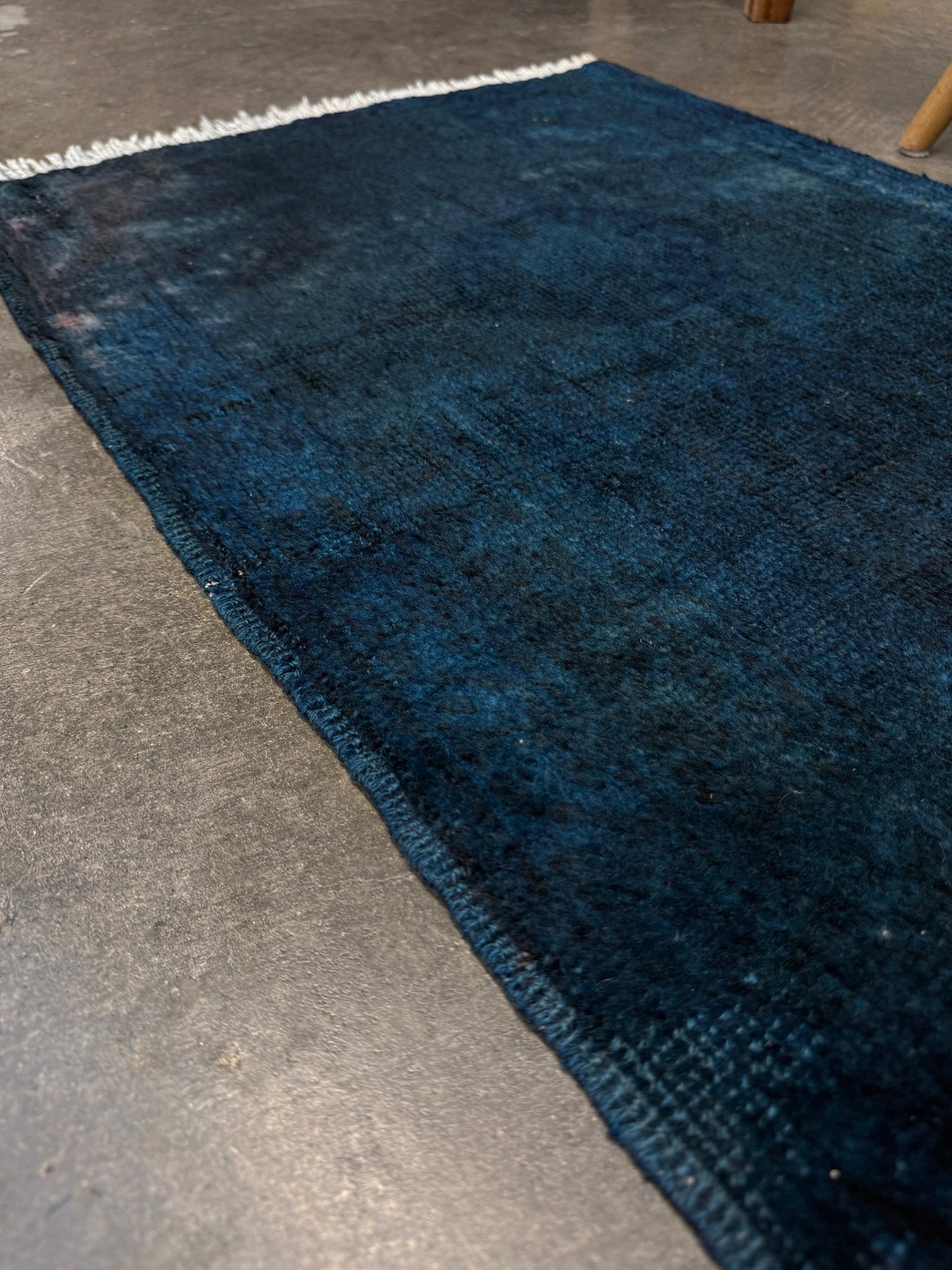 Midnight Blue Turkish overdyed Yastik rug with subtle shadowed motifs. Hand-knotted wool, 20x30 inches. Perfect for: Entryways & apartment foyers, beside the bed, kitchen sink areas, bathroom vanity spots, layered under décor pieces. One-of-a-kind rug from Indigo Rugs in Burlingame, the best rug shop in the San Francisco Bay Area. Free shipping included.