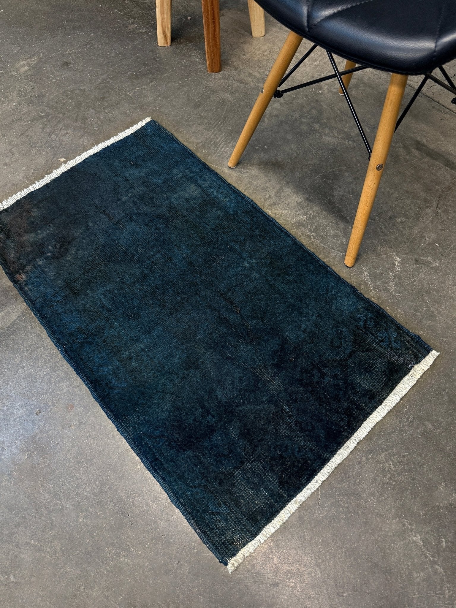Midnight Blue Turkish overdyed Yastik rug with subtle shadowed motifs. Hand-knotted wool, 20x30 inches. Perfect for: Entryways & apartment foyers, beside the bed, kitchen sink areas, bathroom vanity spots, layered under décor pieces. One-of-a-kind rug from Indigo Rugs in Burlingame, the best rug shop in the San Francisco Bay Area. Free shipping included.