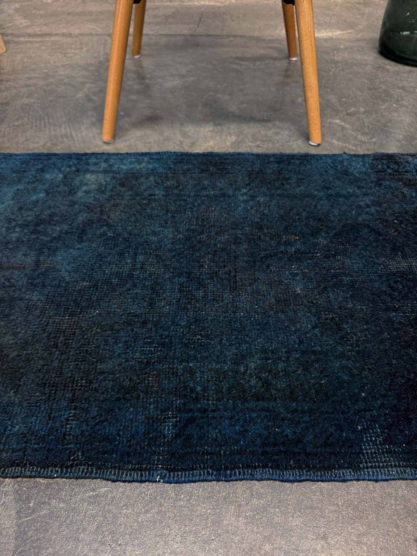Midnight Blue Turkish overdyed Yastik rug with subtle shadowed motifs. Hand-knotted wool, 20x30 inches. Perfect for: Entryways & apartment foyers, beside the bed, kitchen sink areas, bathroom vanity spots, layered under décor pieces. One-of-a-kind rug from Indigo Rugs in Burlingame, the best rug shop in the San Francisco Bay Area. Free shipping included.