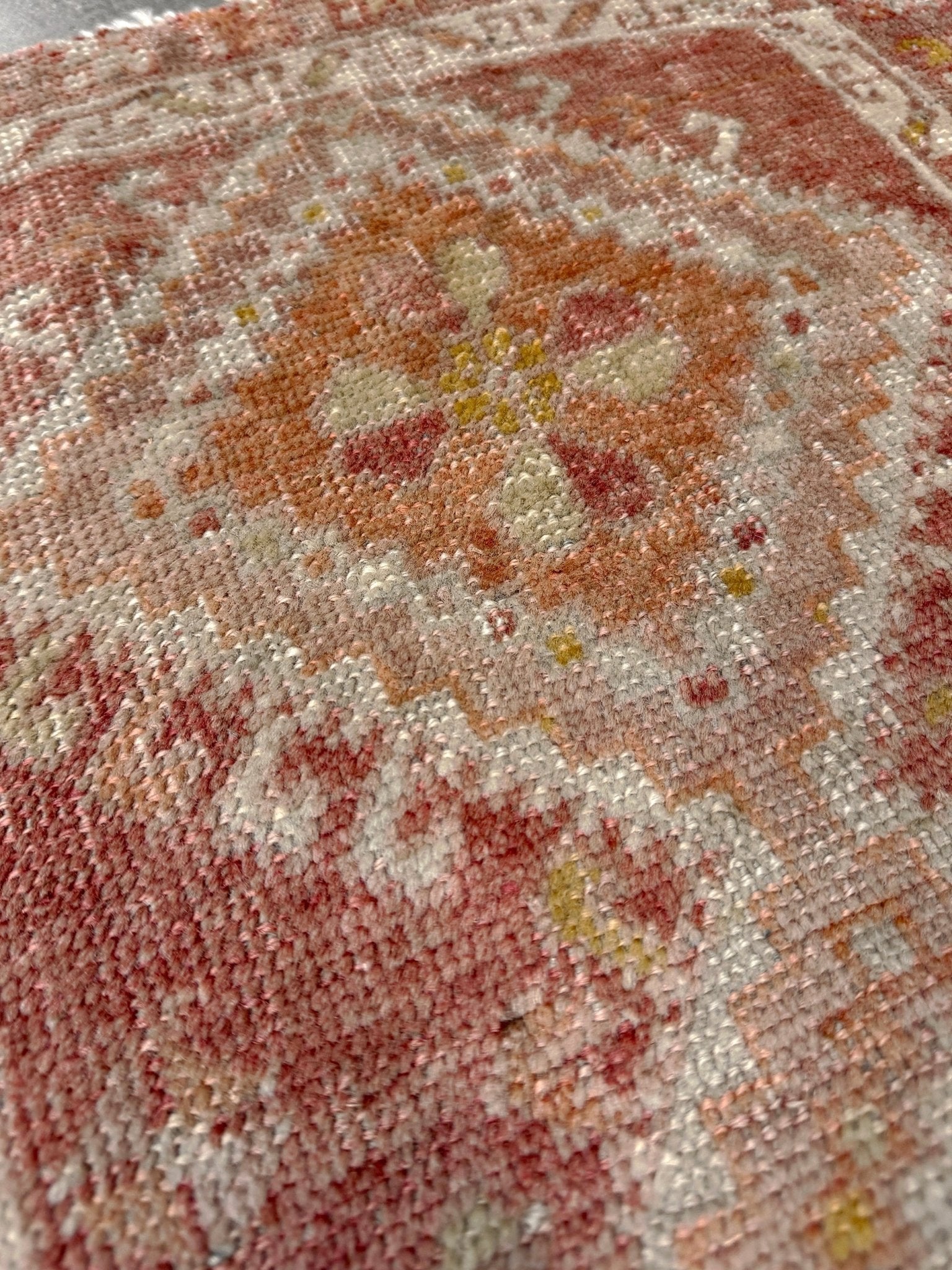 Antique Turkish Yastik rug with dusty terracotta field, faded peach. Hand-knotted wool, 19x36 inches. Circa 1930s–1950s. Perfect for: Entryways, apartment foyers, beside the bed, kitchen sink areas, bathroom vanity spots. One-of-a-kind piece from Indigo Rugs in Burlingame, the best rug shop in the San Francisco Bay Area. Free shipping included. 