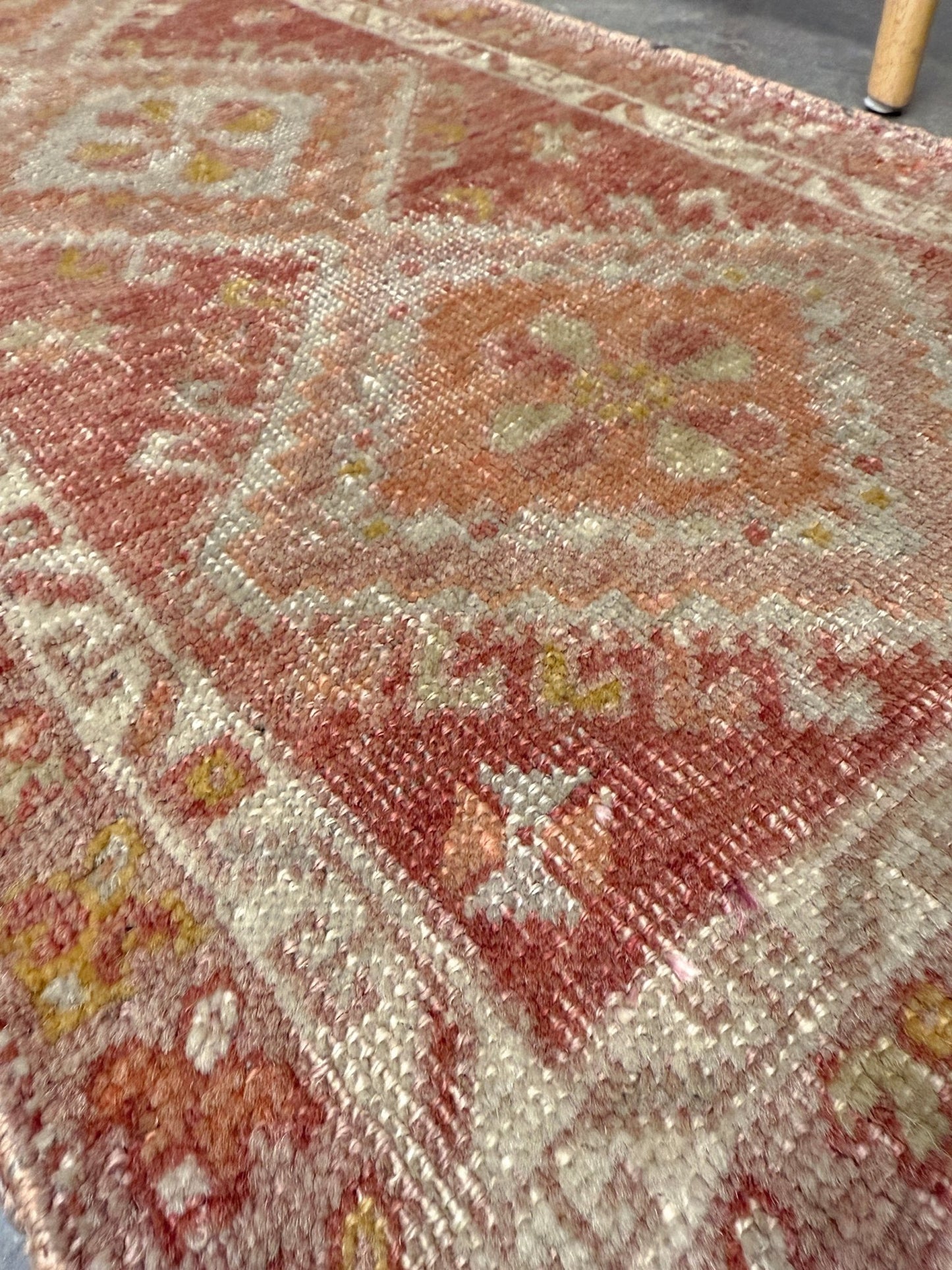 Antique Turkish Yastik rug with dusty terracotta field, faded peach. Hand-knotted wool, 19x36 inches. Circa 1930s–1950s. Perfect for: Entryways, apartment foyers, beside the bed, kitchen sink areas, bathroom vanity spots. One-of-a-kind piece from Indigo Rugs in Burlingame, the best rug shop in the San Francisco Bay Area. Free shipping included. 