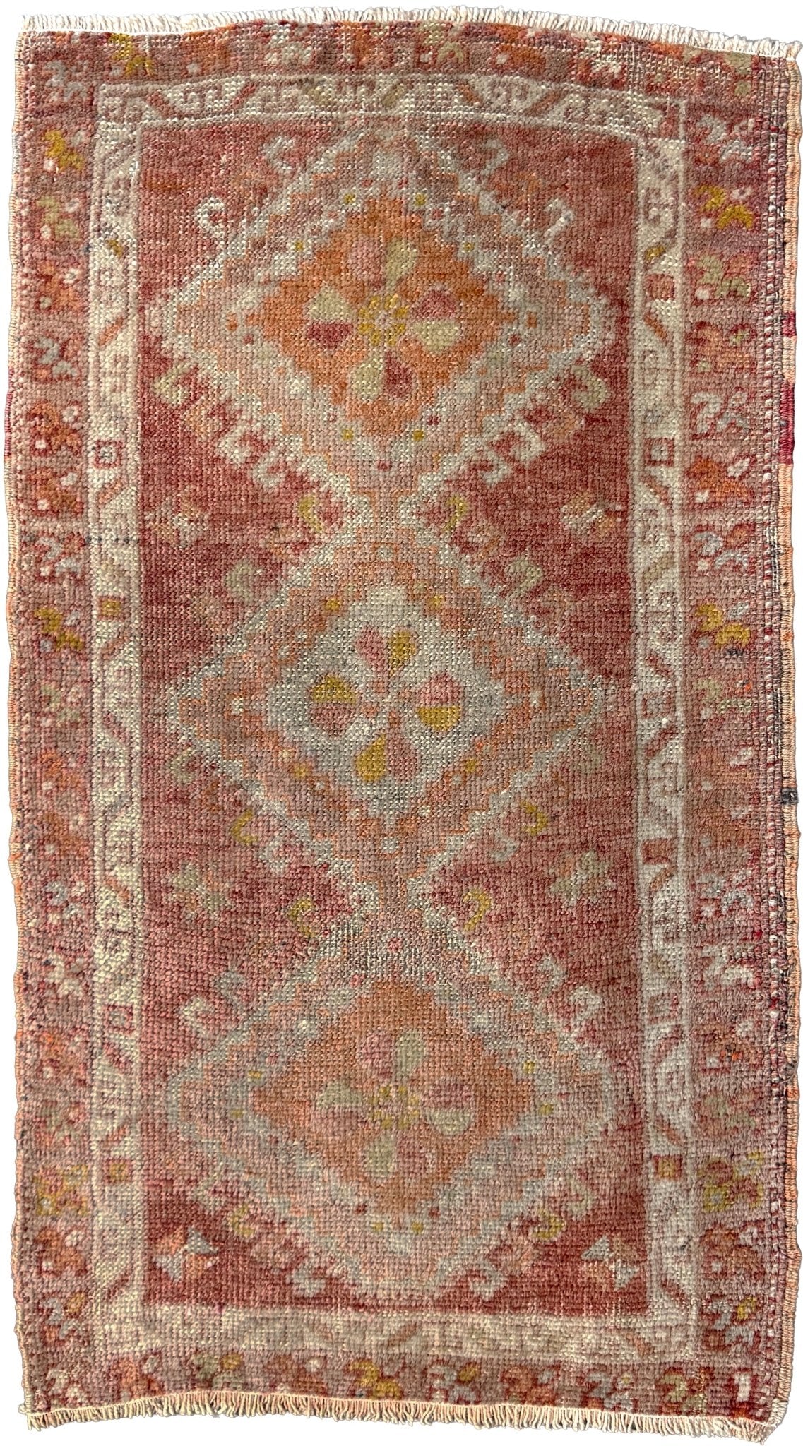 Antique Turkish Yastik rug with dusty terracotta field, faded peach. Hand-knotted wool, 19x36 inches. Circa 1930s–1950s. Perfect for: Entryways &amp; apartment foyers, beside the bed, kitchen sink areas, bathroom vanity spots. One-of-a-kind piece from Indigo Rugs in Burlingame, the best rug shop in the San Francisco Bay Area. Free shipping included. 