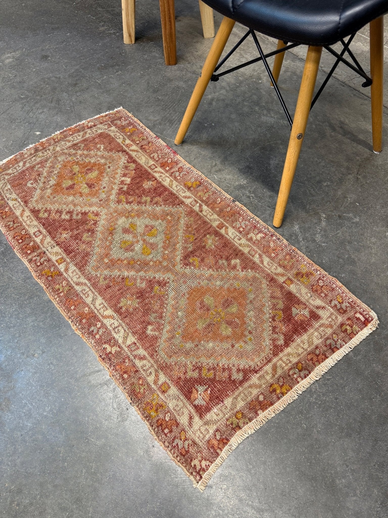 Antique Turkish Yastik rug with dusty terracotta field, faded peach. Hand-knotted wool, 19x36 inches. Circa 1930s–1950s. Perfect for: Entryways, apartment foyers, beside the bed, kitchen sink areas, bathroom vanity spots. One-of-a-kind piece from Indigo Rugs in Burlingame, the best rug shop in the San Francisco Bay Area. Free shipping included. 