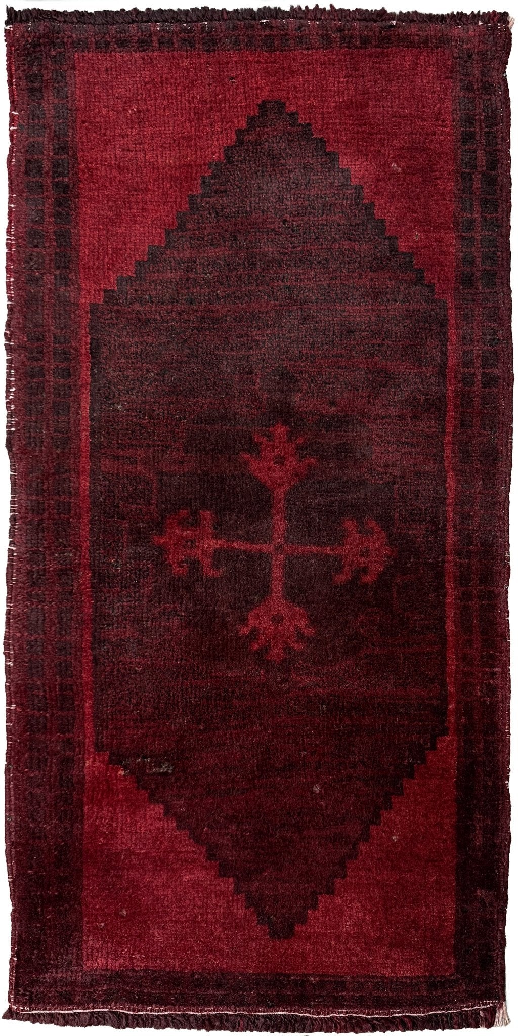 Vintage Turkish overdyed Yastik rug in ruby red tones with subtle shadowed motifs. Hand-knotted wool, 18x40 inches. Perfect for: Entryway, apartment foyers, beside the bed, kitchen sink areas, bathroom vanity spots, layered under décor piecesOne-of-a-kind rug from Indigo Rugs in Burlingame, the best rug shop in the San Francisco Bay Area. Free shipping included.