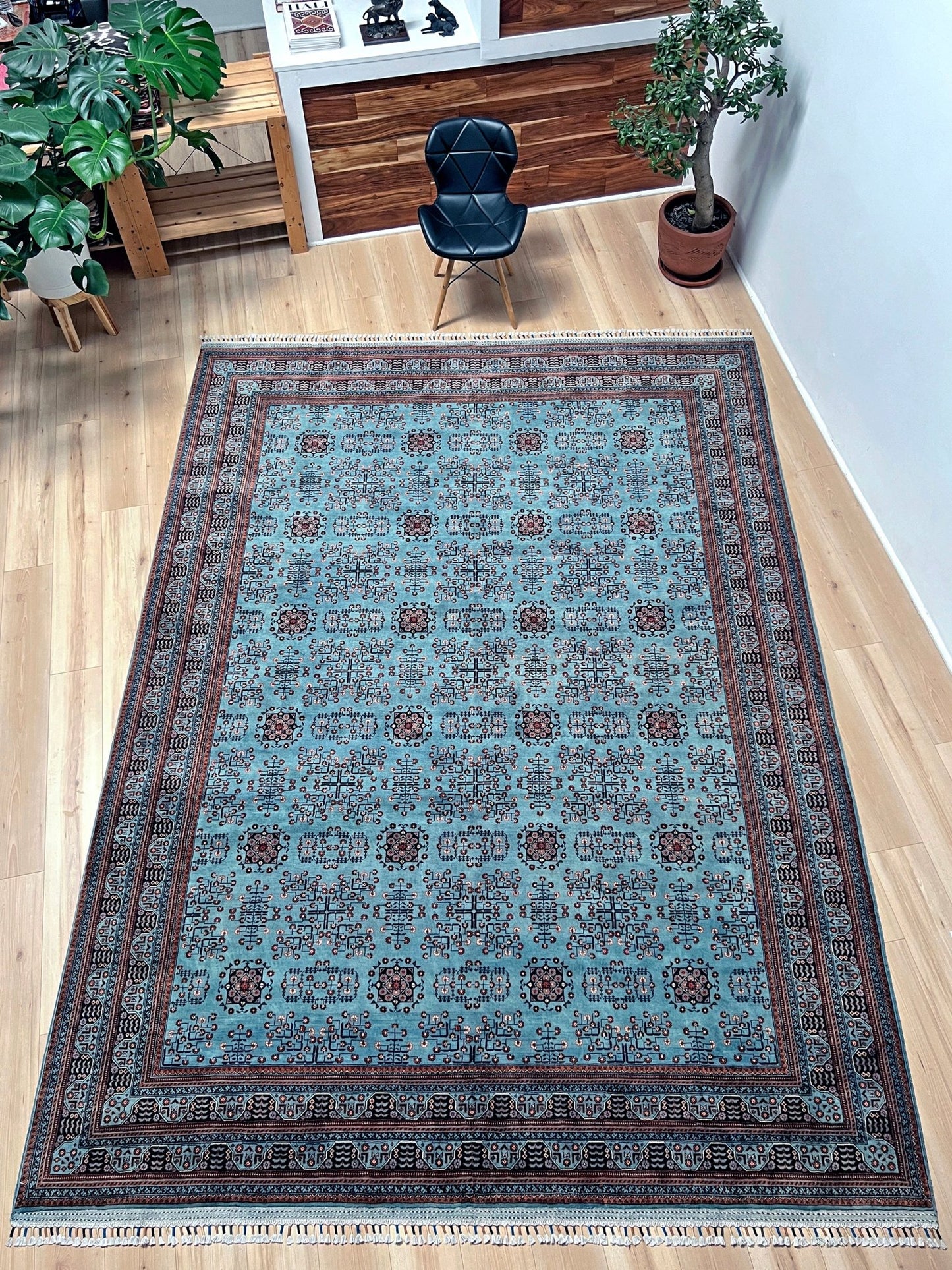 Handmade Turkmen rug with a baby blue ground, featuring traditional geometric motifs in brown, red, and white, crafted from silky Ghazni wool with a luxurious sheen, available with free shipping from the best handmade rug shop in the San Francisco Bay Area.