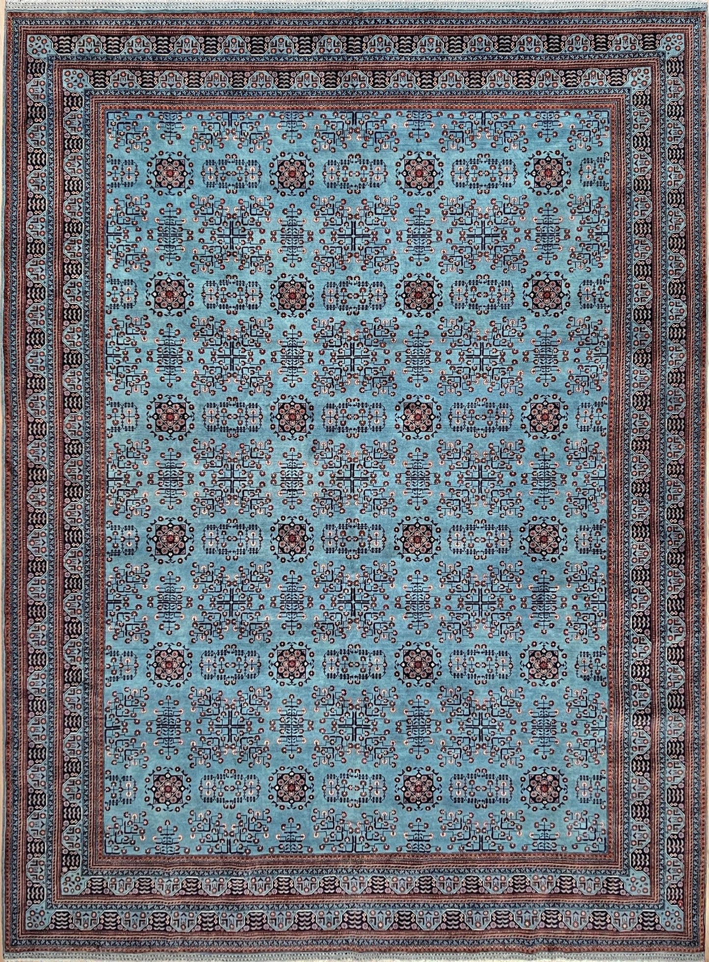 Handmade Turkmen rug with a baby blue ground, featuring traditional geometric motifs in brown, red, and white, crafted from silky Ghazni wool with a luxurious sheen, available with free shipping from the best handmade rug shop in the San Francisco Bay Area.