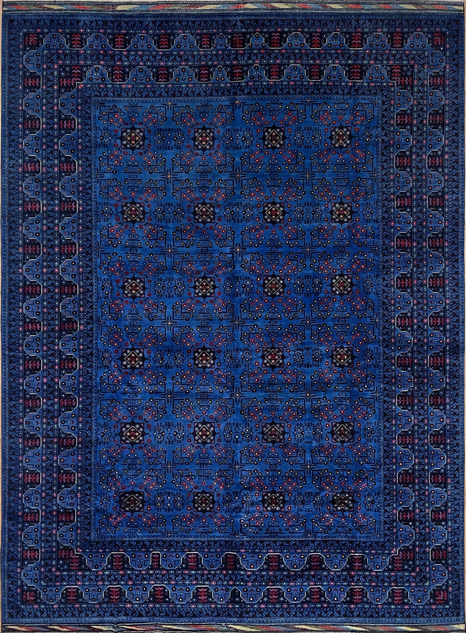 Handmade Turkmen rug in rich deep blue with intricate floral and geometric patterns, crafted from luxurious Ghazni wool. Available at the best handmade rug shop in the SF Bay Area, offering timeless craftsmanship and cultural elegance in every piece.