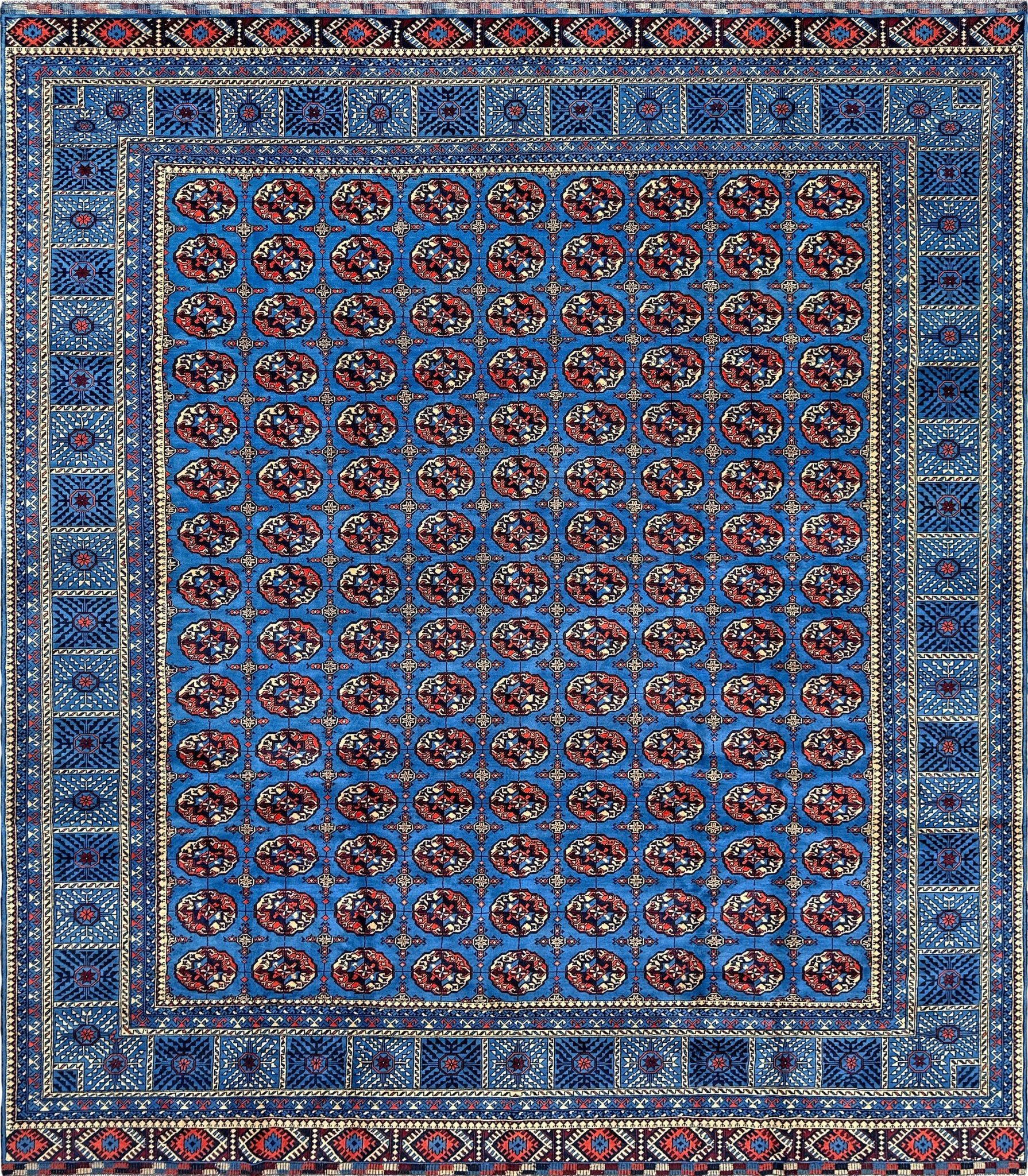 Handmade 10x14 Turkmen Bukhara rug in Royal blue with oxblood red and ivory accents, available from top-rated rug shop in San Mateo, SF Bay Area. Perfect for bedroom, living room, dining room, or study. Free shipping included.