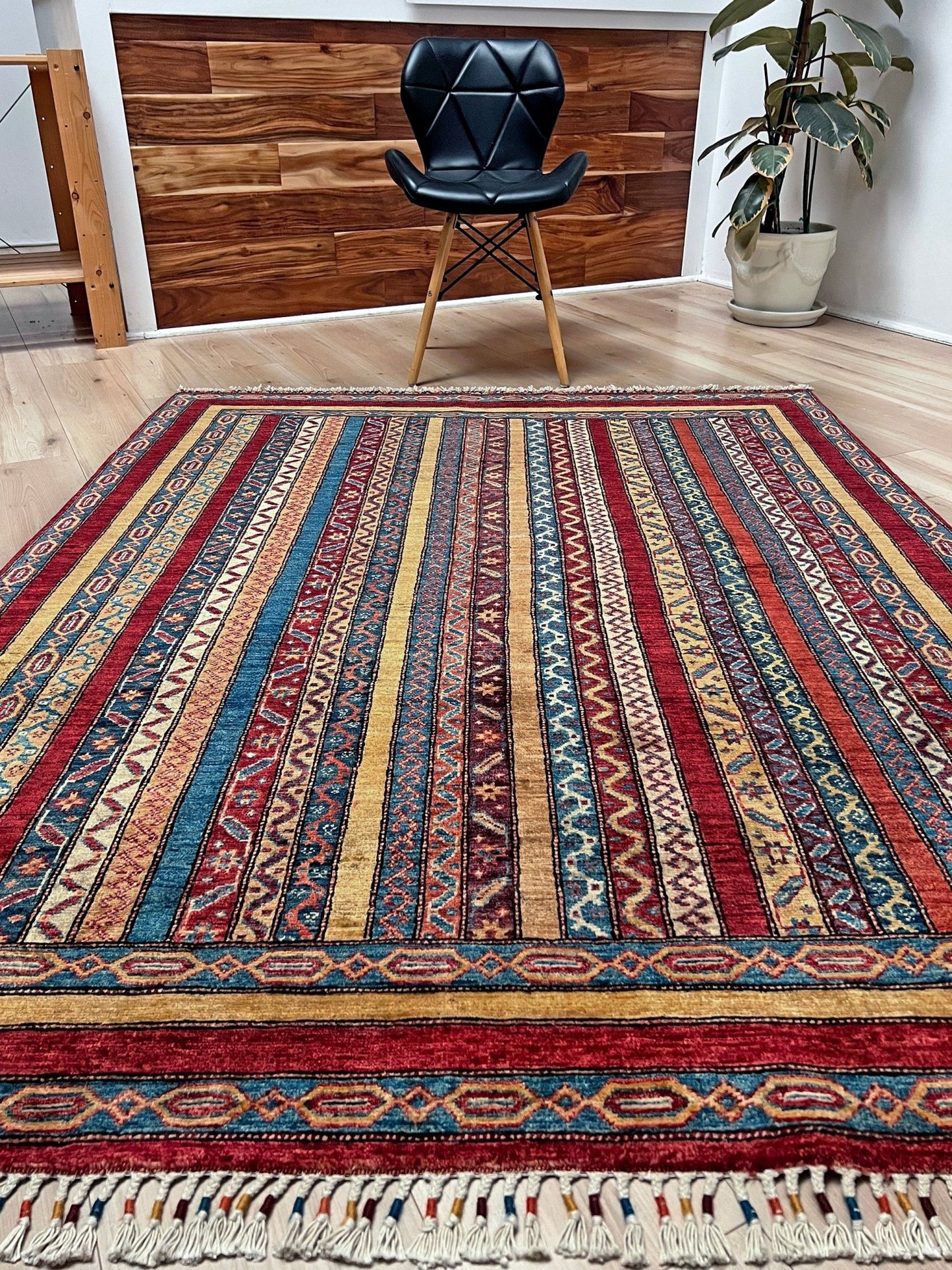 Handmade Turkish Shawl Rug with vibrant vertical stripes in red, blue, yellow, and cream, featuring intricate tribal motifs from the best luxury rug shop in the San Francisco Bay Area. High-quality wool rug at an affordable price with free shipping. Perfect for adding a touch of Turkish craftsmanship to any room. Ideal statement piece for living rooms, bedrooms, and entryways.