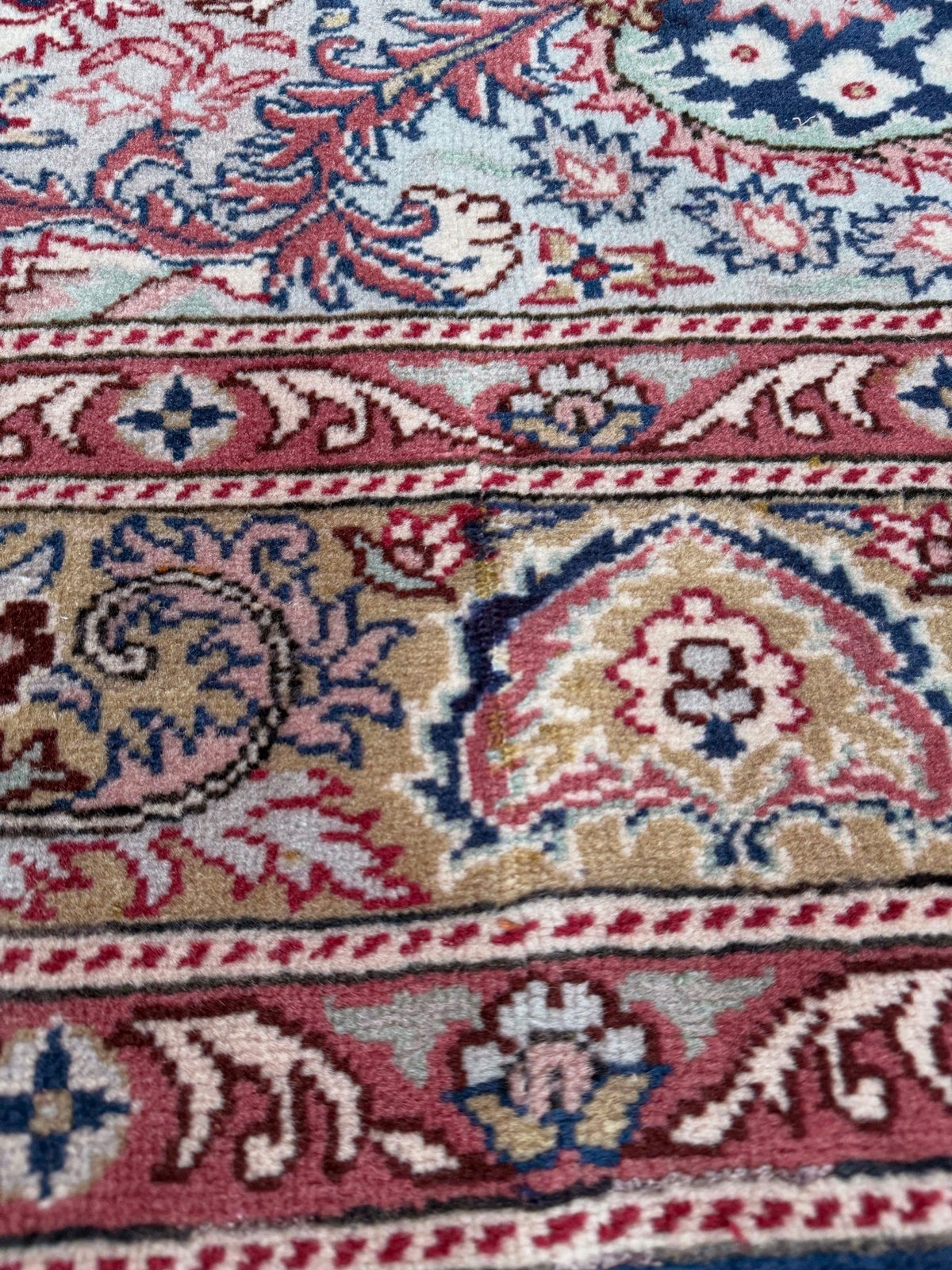 Blue vintage Turkish rug with deep blue field,  floral medallion, handmade wool 7x9 from Indigo Rugs Burlingame Bay Area.