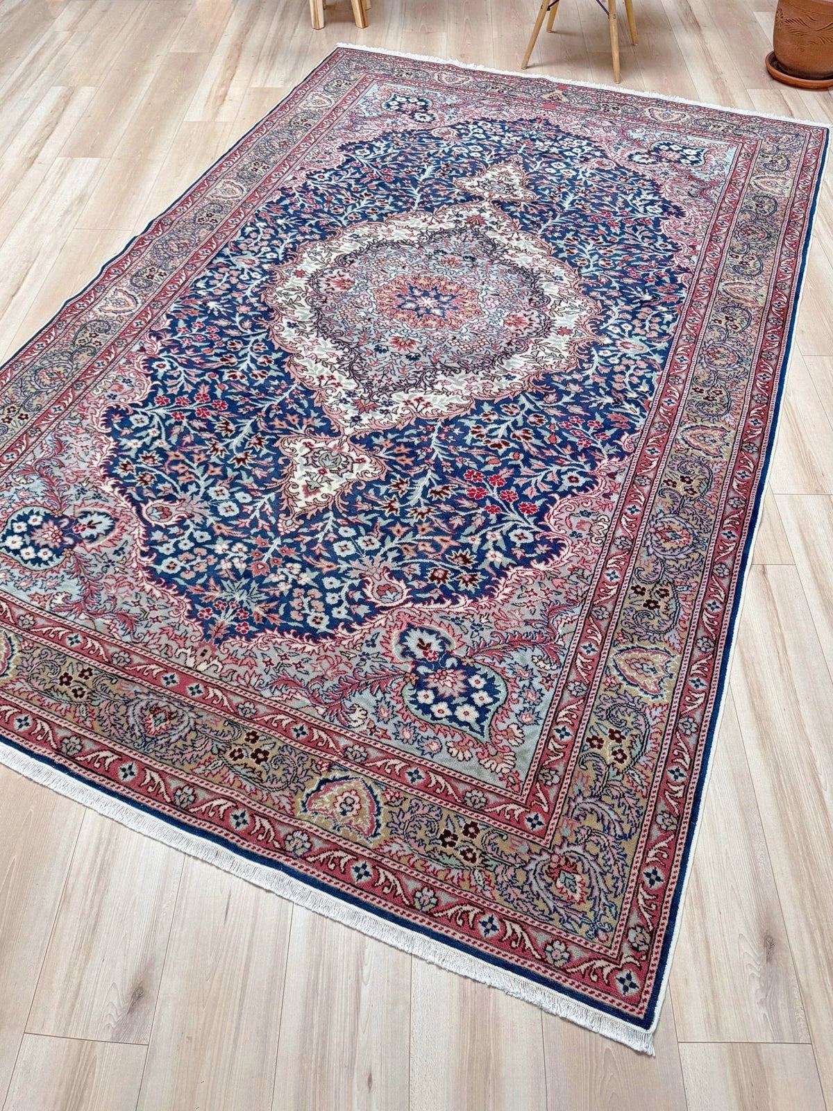  Blue vintage Turkish rug with deep blue field,  floral medallion, handmade wool 7x9 from Indigo Rugs Burlingame Bay Area.