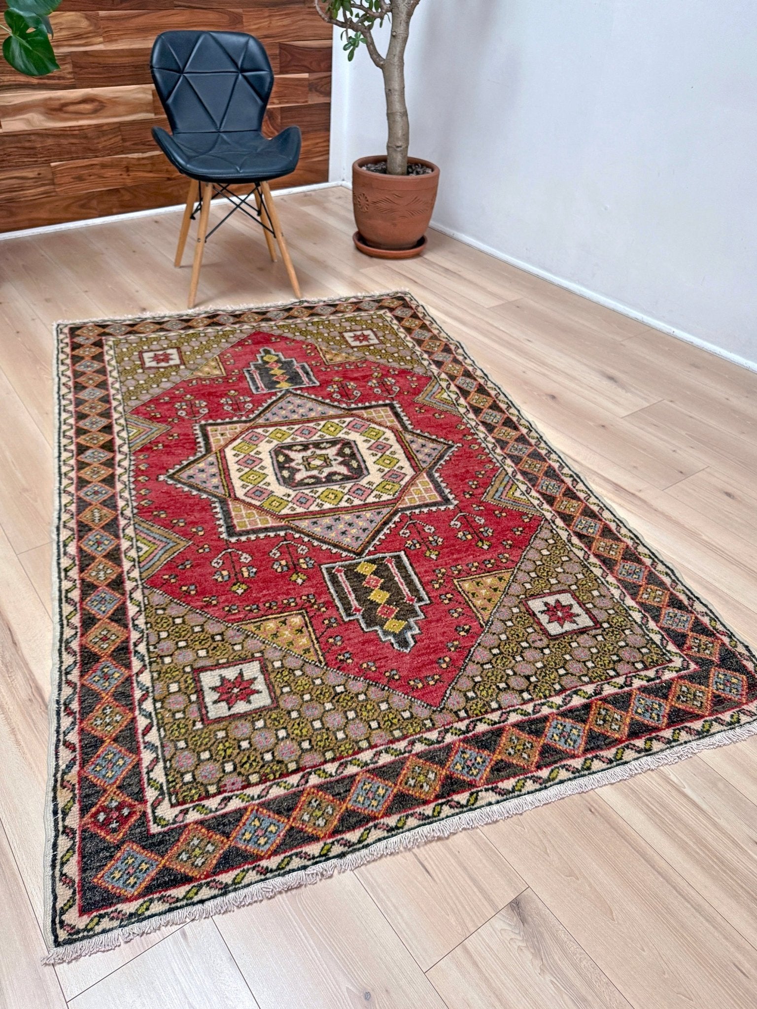 5x7 Vintage Turkish rug in rich crimson red with intricate medallion design, —perfect for bedroom, living room, or dining space. High-quality wool rug with vibrant hues of mustard yellow, olive green, and pale pink. Available at the best rug shop in San Mateo, SF Bay Area, with free shipping. Timeless character and craftsmanship for a stylish, cozy home.