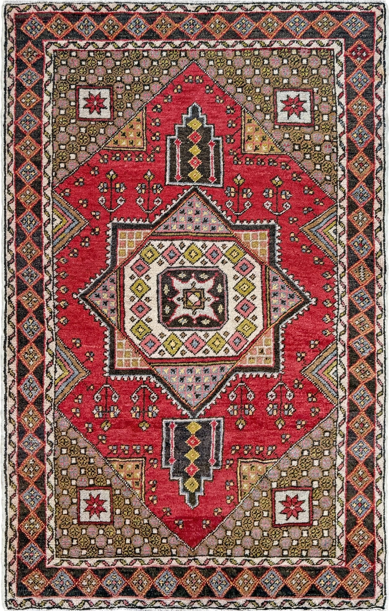 5x7 Vintage Turkish rug in rich crimson red with intricate medallion design, —perfect for bedroom, living room, or dining space. High-quality wool rug with vibrant hues of mustard yellow, olive green, and pale pink. Available at the best rug shop in San Mateo, SF Bay Area, with free shipping. Timeless character and craftsmanship for a stylish, cozy home.