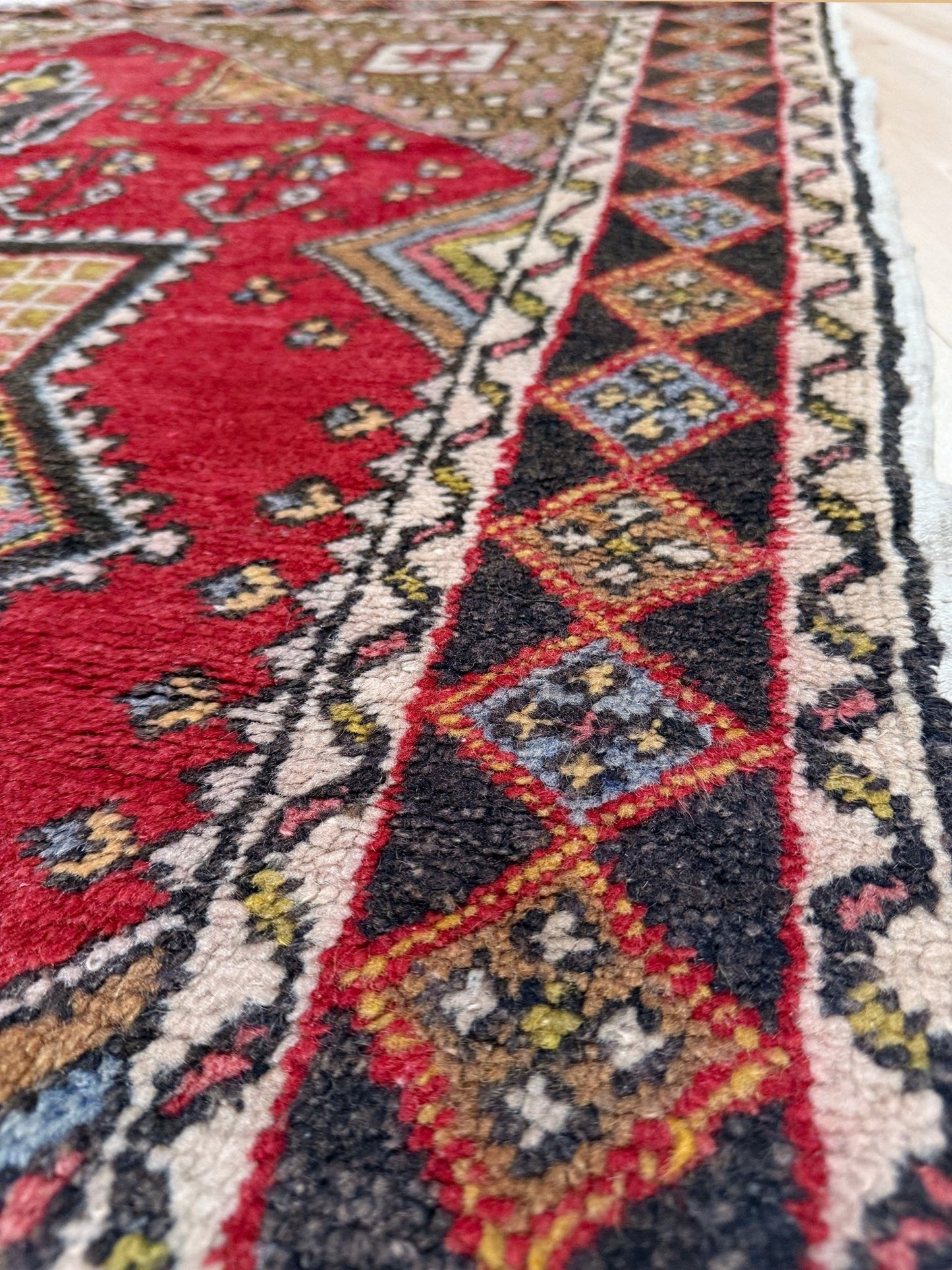 5x7 Vintage Turkish rug in rich crimson red with intricate medallion design, —perfect for bedroom, living room, or dining space. High-quality wool rug with vibrant hues of mustard yellow, olive green, and pale pink. Available at the best rug shop in San Mateo, SF Bay Area, with free shipping. Timeless character and craftsmanship for a stylish, cozy home.