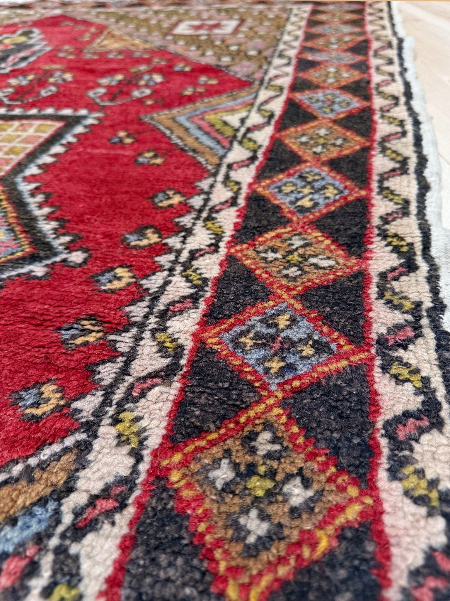 5x7 Vintage Turkish rug in rich crimson red with intricate medallion design, —perfect for bedroom, living room, or dining space. High-quality wool rug with vibrant hues of mustard yellow, olive green, and pale pink. Available at the best rug shop in San Mateo, SF Bay Area, with free shipping. Timeless character and craftsmanship for a stylish, cozy home.