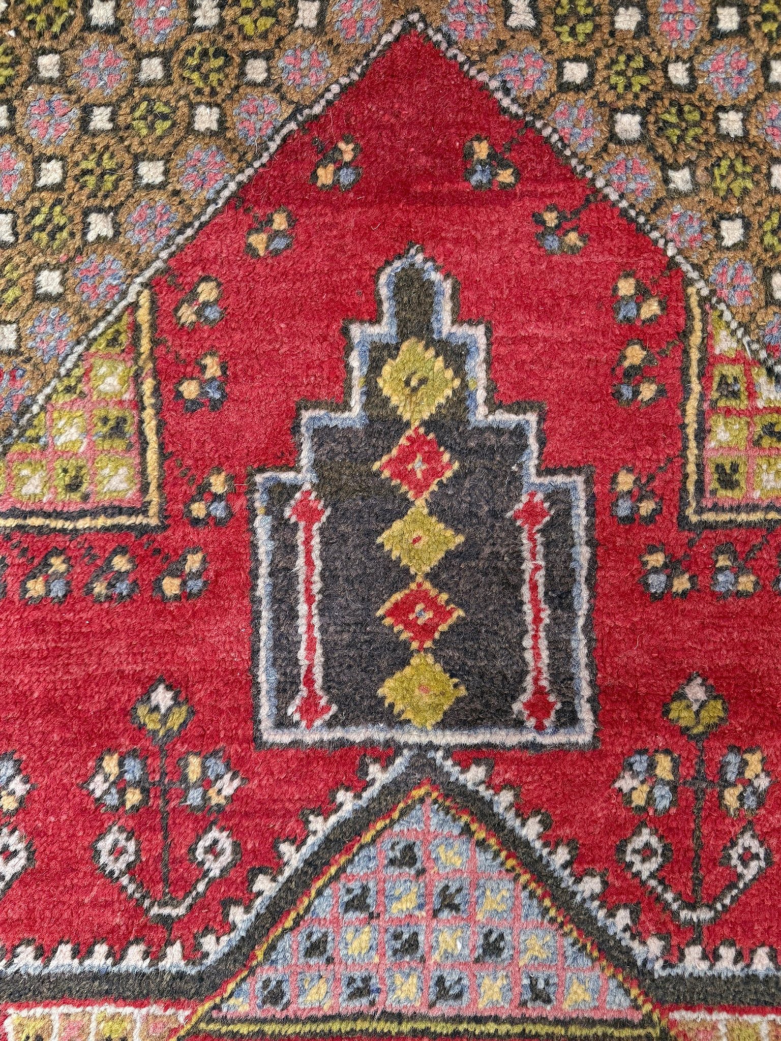 5x7 Vintage Turkish rug in rich crimson red with intricate medallion design, floral and geometric motifs—perfect for bedroom, living room, or dining space. High-quality wool rug with vibrant hues of mustard yellow, olive green, and pale pink. Available at the best rug shop in San Mateo, SF Bay Area, with free shipping. Timeless character and craftsmanship for a stylish, cozy home.