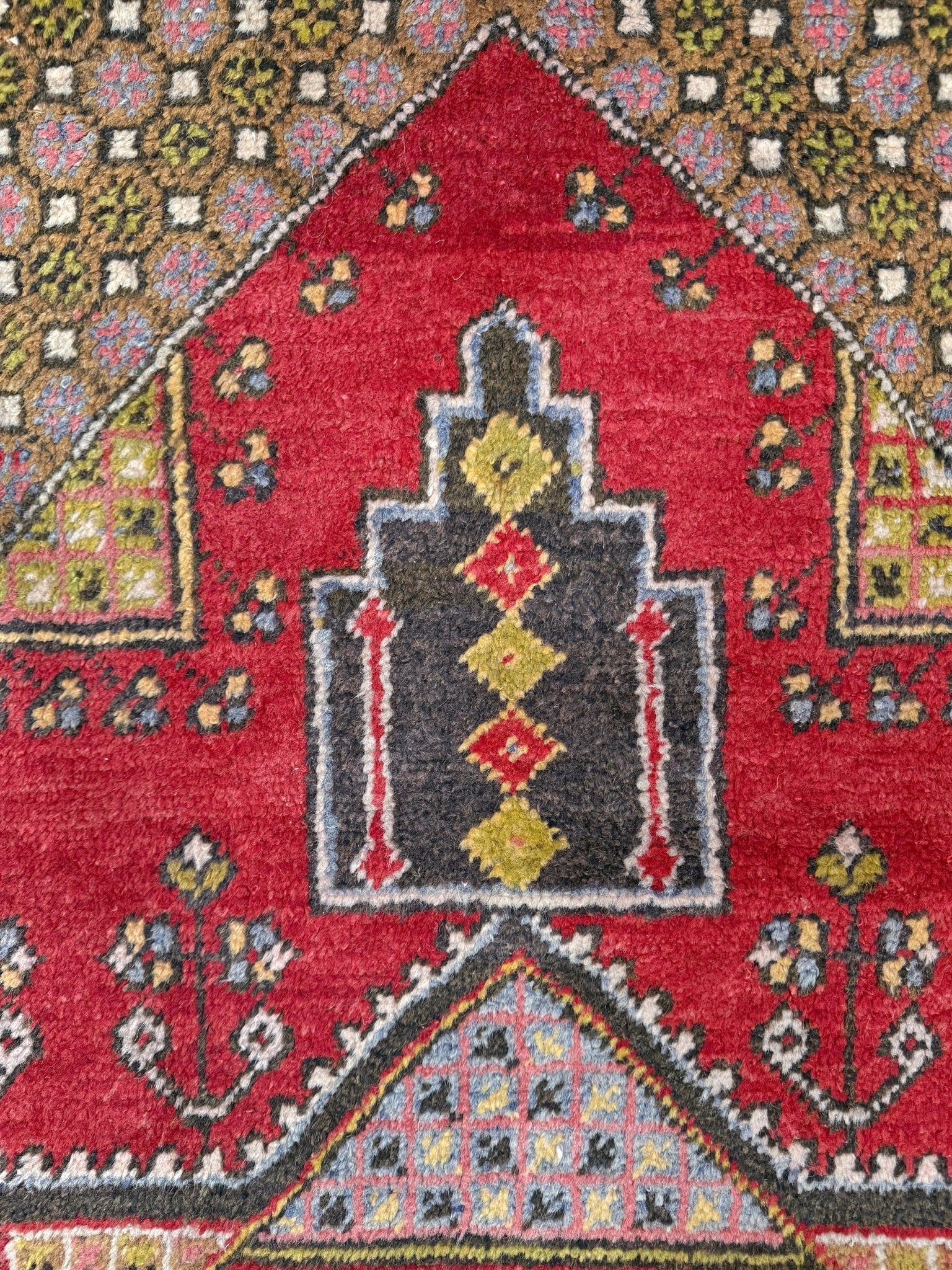 5x7 Vintage Turkish rug in rich crimson red with intricate medallion design, —perfect for bedroom, living room, or dining space. High-quality wool rug with vibrant hues of mustard yellow, olive green, and pale pink. Available at the best rug shop in San Mateo, SF Bay Area, with free shipping. Timeless character and craftsmanship for a stylish, cozy home.