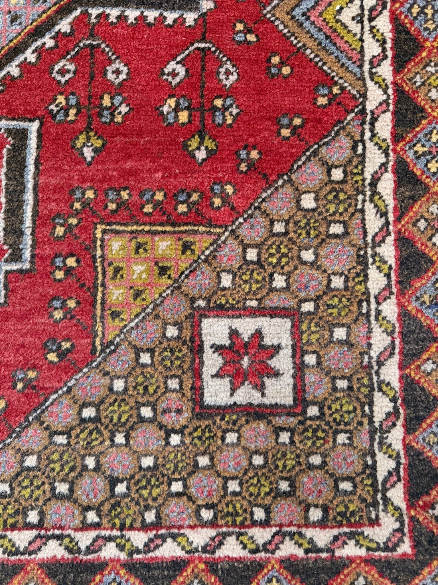 5x7 Vintage Turkish rug in rich crimson red with intricate medallion design, —perfect for bedroom, living room, or dining space. High-quality wool rug with vibrant hues of mustard yellow, olive green, and pale pink. Available at the best rug shop in San Mateo, SF Bay Area, with free shipping. Timeless character and craftsmanship for a stylish, cozy home.
