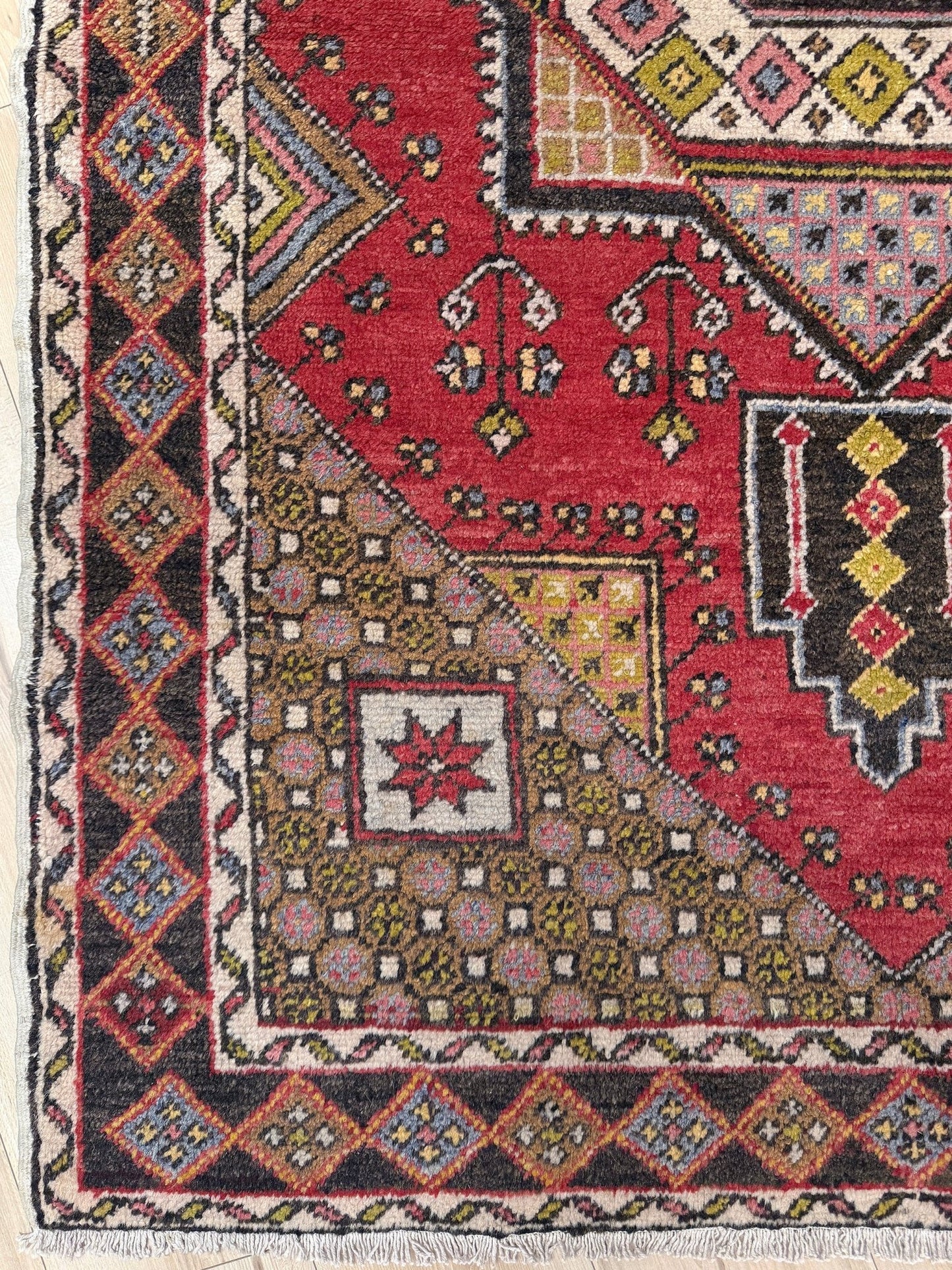 5x7 Vintage Turkish rug in rich crimson red with intricate medallion design, —perfect for bedroom, living room, or dining space. High-quality wool rug with vibrant hues of mustard yellow, olive green, and pale pink. Available at the best rug shop in San Mateo, SF Bay Area, with free shipping. Timeless character and craftsmanship for a stylish, cozy home.
