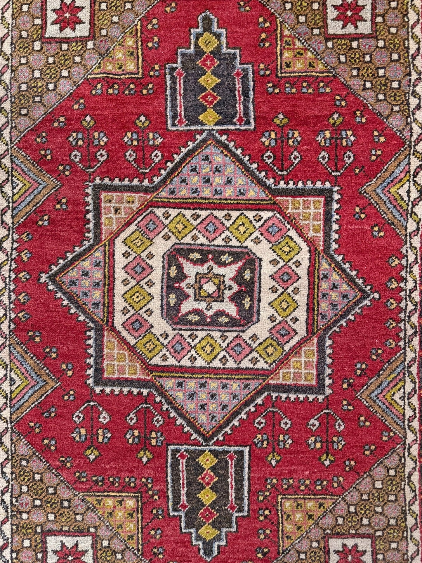 5x7 Vintage Turkish rug in rich crimson red with intricate medallion design, —perfect for bedroom, living room, or dining space. High-quality wool rug with vibrant hues of mustard yellow, olive green, and pale pink. Available at the best rug shop in San Mateo, SF Bay Area, with free shipping. Timeless character and craftsmanship for a stylish, cozy home.