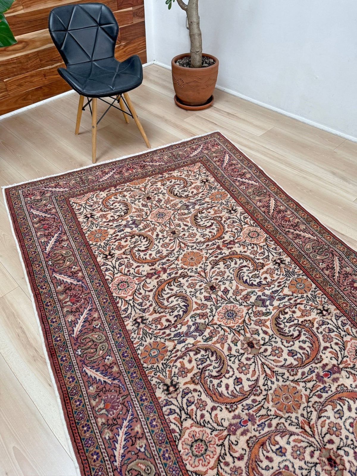 Vintage floral handmade Turkish wool rug with an ivory field and scrolling botanical motifs in terracotta, soft rose, olive green,  5x7 rug from Indigo Rugs in Burlingame, the best rug shop in the San Francisco Bay Area. Free shipping included.