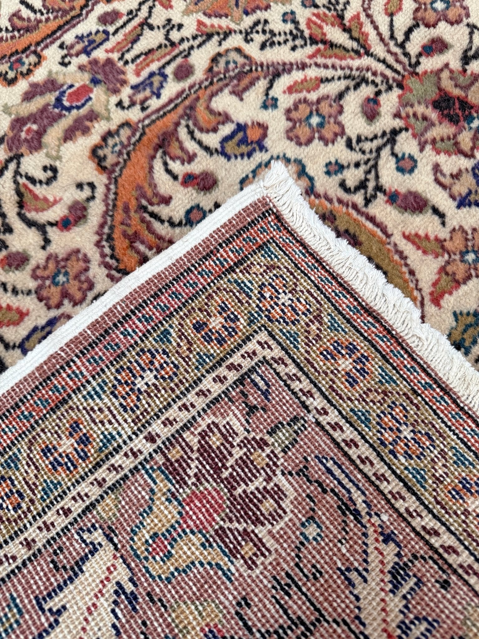 Vintage floral Kayseri handmade Turkish wool rug with an ivory field and scrolling botanical motifs in terracotta, soft rose, olive green, lavender, and ink blue. Size 5x7 ft. One-of-a-kind rug from Indigo Rugs in Burlingame, the best rug shop in the San Francisco Bay Area. Free shipping included.