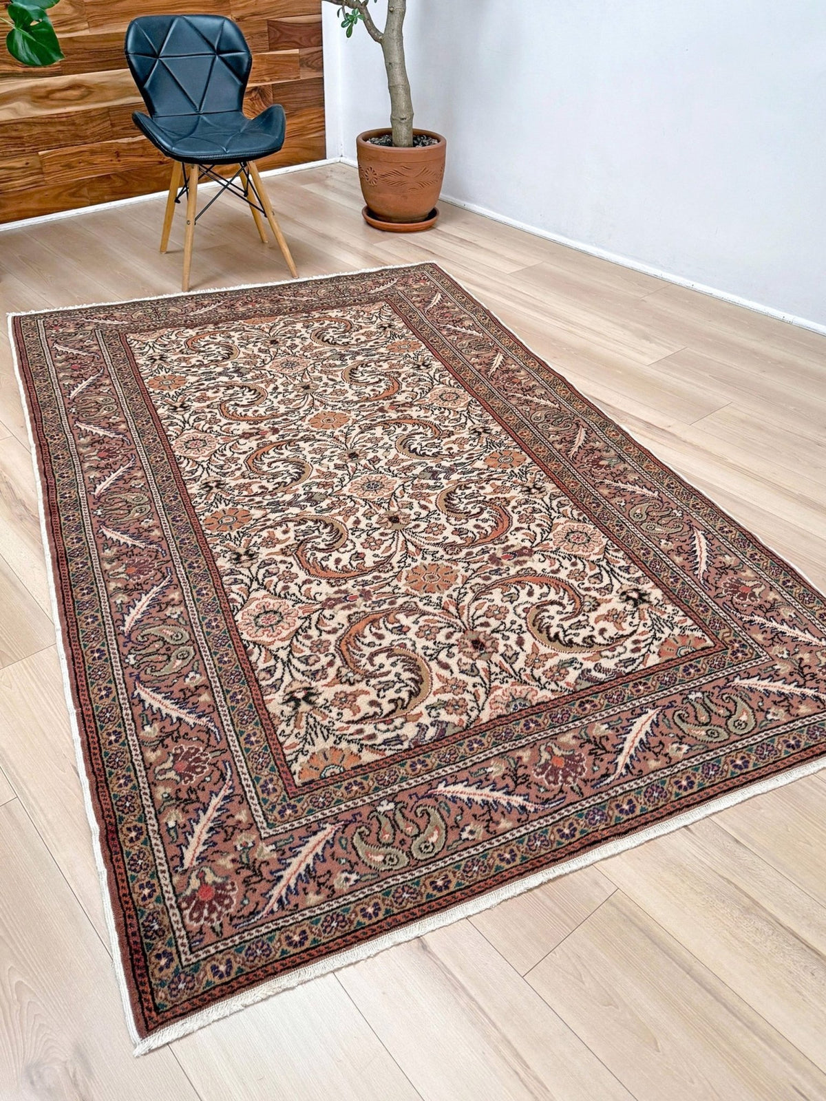 Vintage floral handmade Turkish wool rug with an ivory field and scrolling botanical motifs in terracotta, soft rose, olive green,  5x7 rug from Indigo Rugs in Burlingame, the best rug shop in the San Francisco Bay Area. Free shipping included.