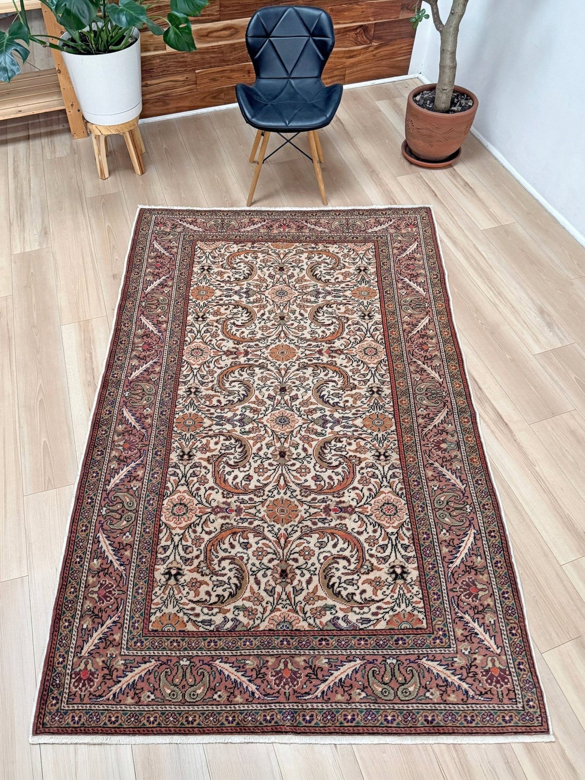 Vintage floral handmade Turkish wool rug with an ivory field and scrolling botanical motifs in terracotta, soft rose, olive green,  5x7 rug from Indigo Rugs in Burlingame, the best rug shop in the San Francisco Bay Area. Free shipping included.