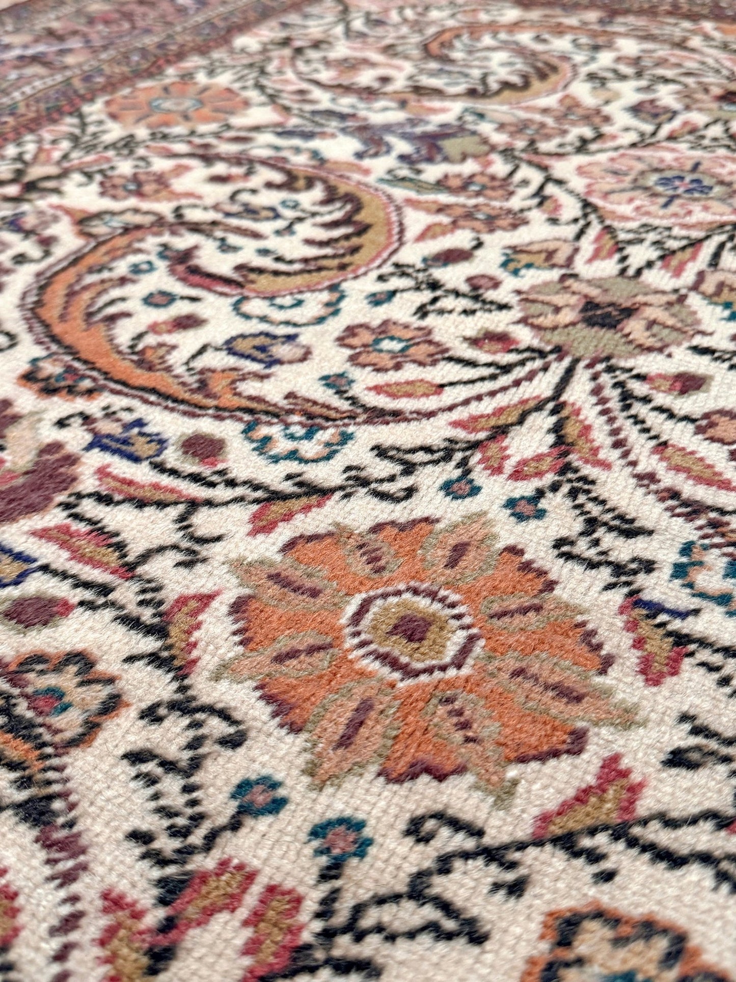 Vintage floral Kayseri handmade Turkish wool rug with an ivory field and scrolling botanical motifs in terracotta, soft rose, olive green, lavender, and ink blue. Size 5x7 ft. One-of-a-kind rug from Indigo Rugs in Burlingame, the best rug shop in the San Francisco Bay Area. Free shipping included.