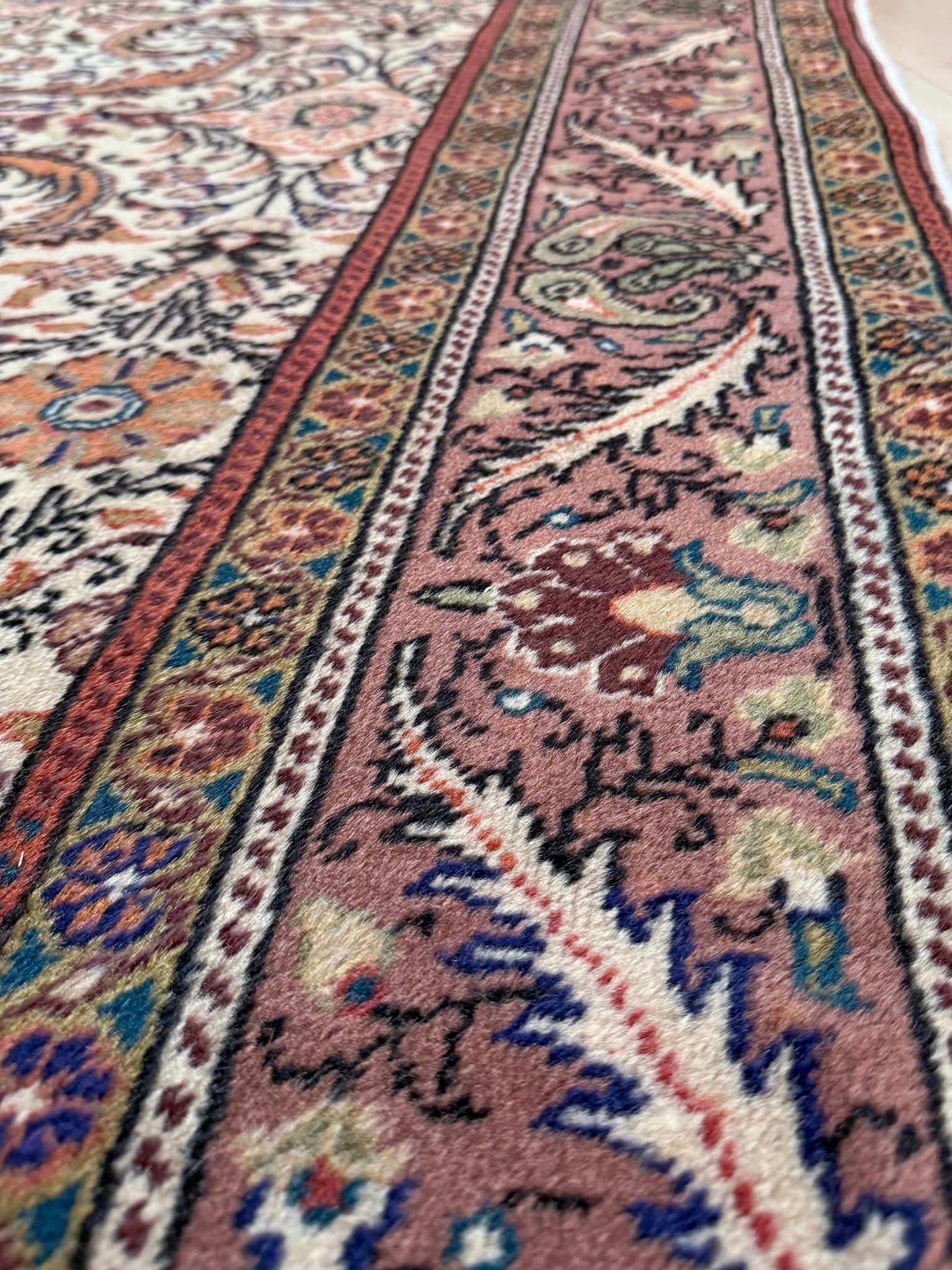 Vintage floral Kayseri handmade Turkish wool rug with an ivory field and scrolling botanical motifs in terracotta, soft rose, olive green, lavender, and ink blue. Size 5x7 ft. One-of-a-kind rug from Indigo Rugs in Burlingame, the best rug shop in the San Francisco Bay Area. Free shipping included.