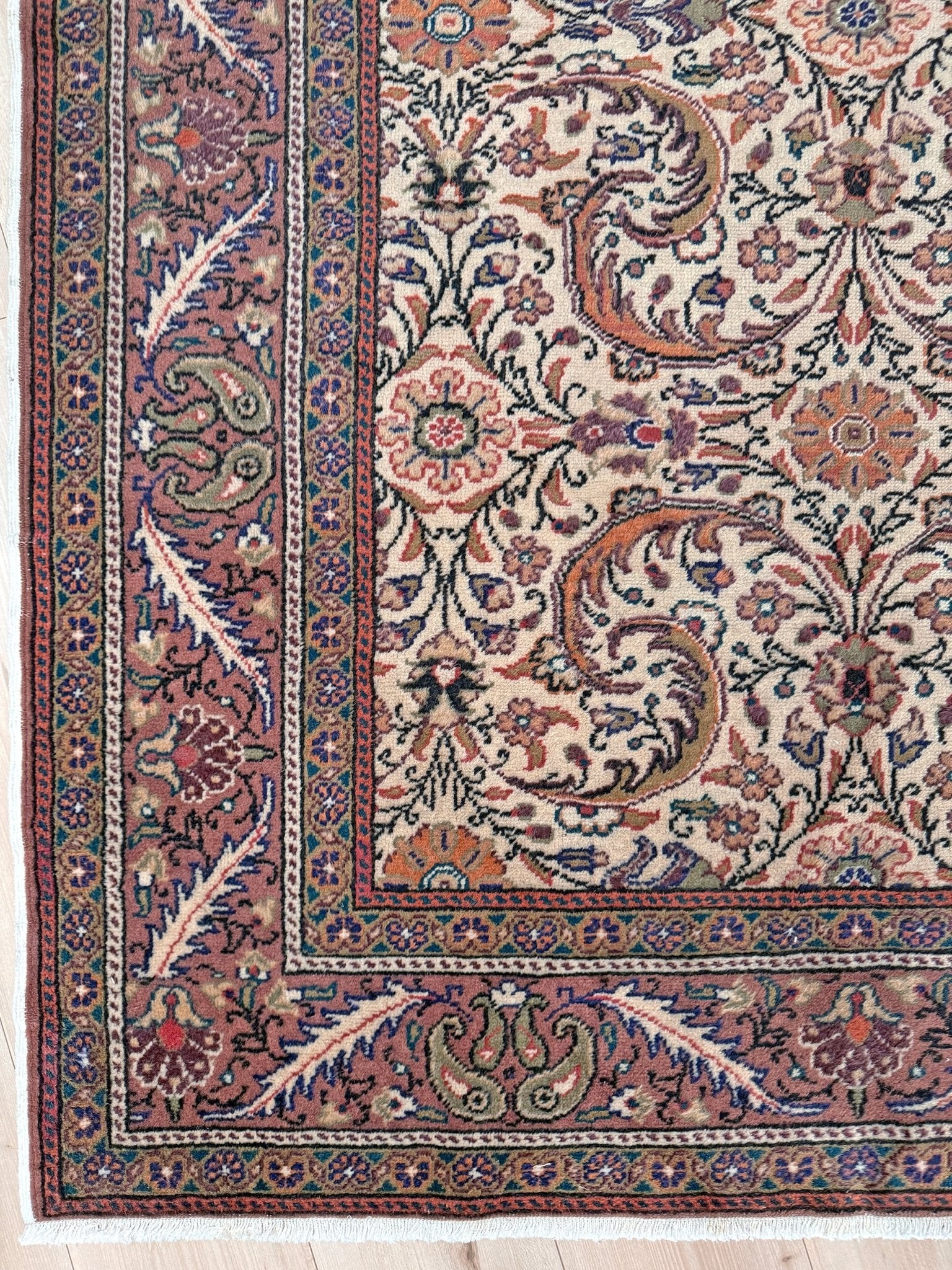 Vintage floral Kayseri handmade Turkish wool rug with an ivory field and scrolling botanical motifs in terracotta, soft rose, olive green, lavender, and ink blue. Size 5x7 ft. One-of-a-kind rug from Indigo Rugs in Burlingame, the best rug shop in the San Francisco Bay Area. Free shipping included.