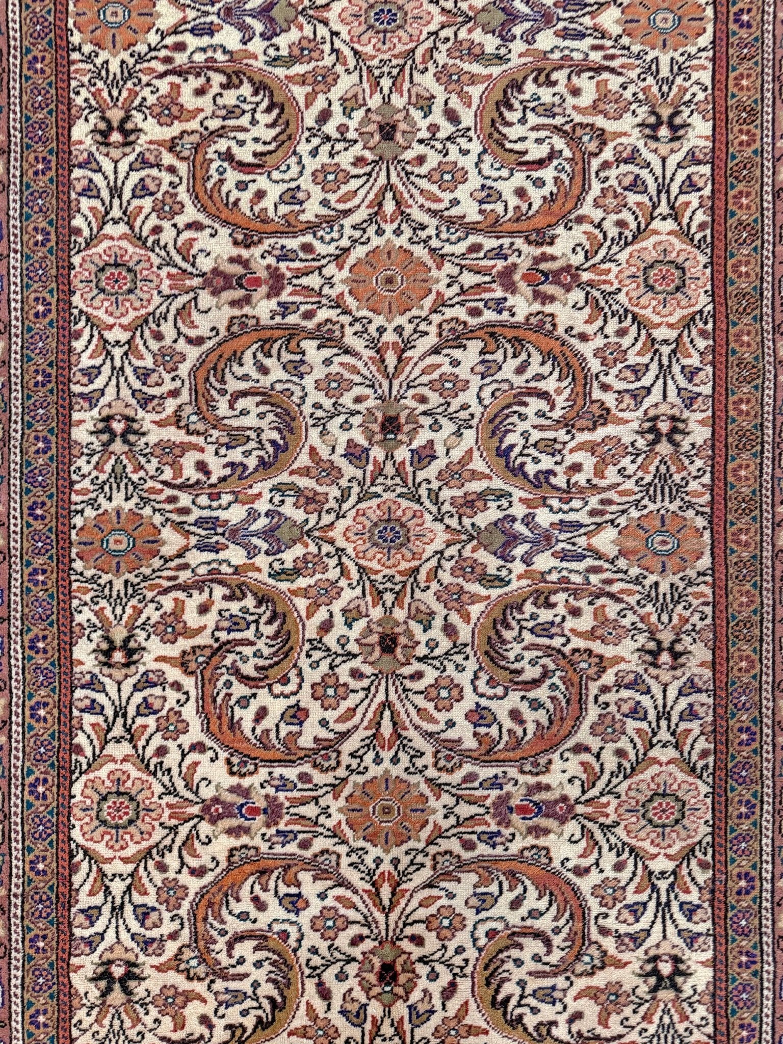 Vintage floral Kayseri handmade Turkish wool rug with an ivory field and scrolling botanical motifs in terracotta, soft rose, olive green, lavender, and ink blue. Size 5x7 ft. One-of-a-kind rug from Indigo Rugs in Burlingame, the best rug shop in the San Francisco Bay Area. Free shipping included.