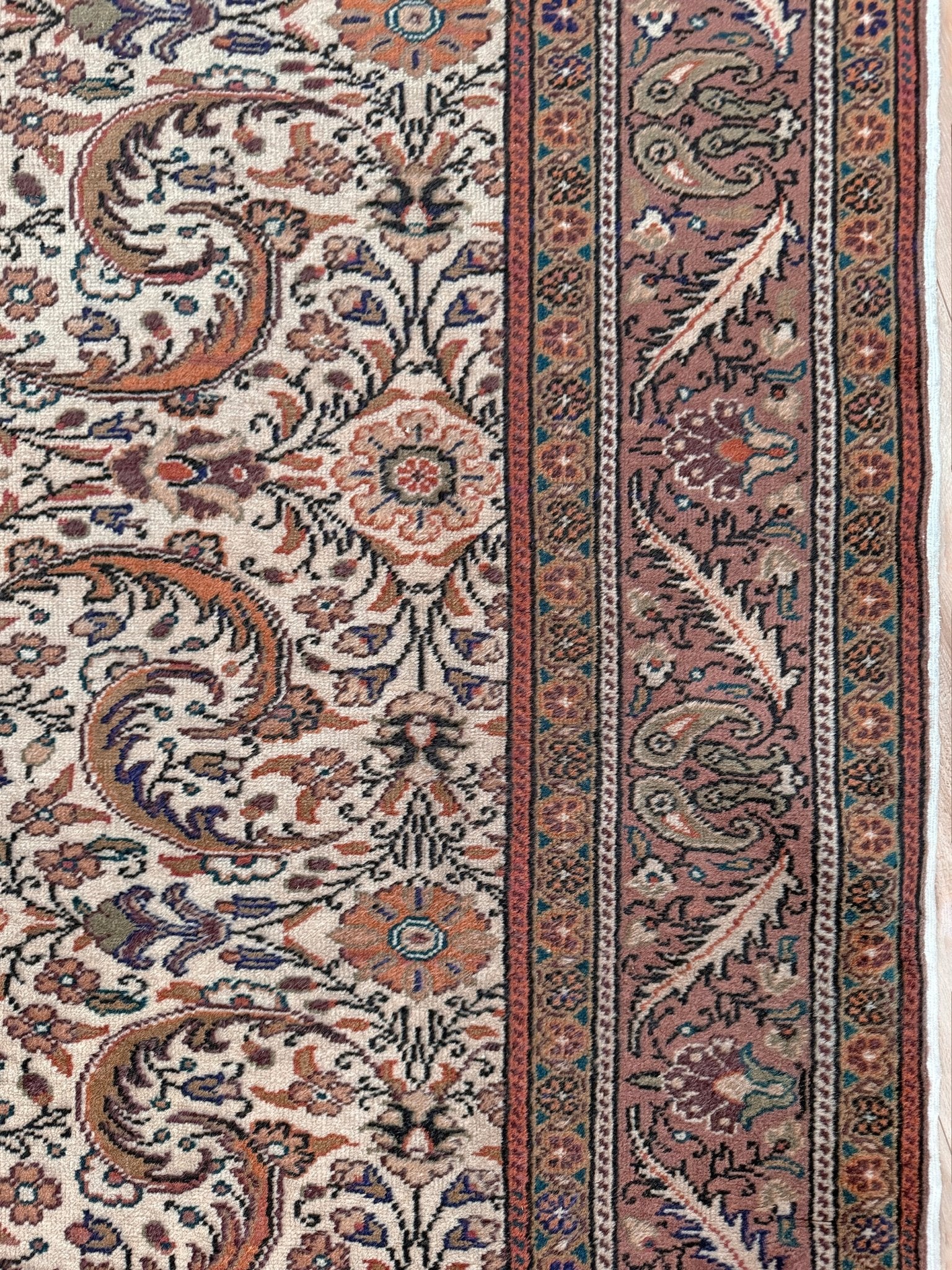 Vintage floral Kayseri handmade Turkish wool rug with an ivory field and scrolling botanical motifs in terracotta, soft rose, olive green, lavender, and ink blue. Size 5x7 ft. One-of-a-kind rug from Indigo Rugs in Burlingame, the best rug shop in the San Francisco Bay Area. Free shipping included.