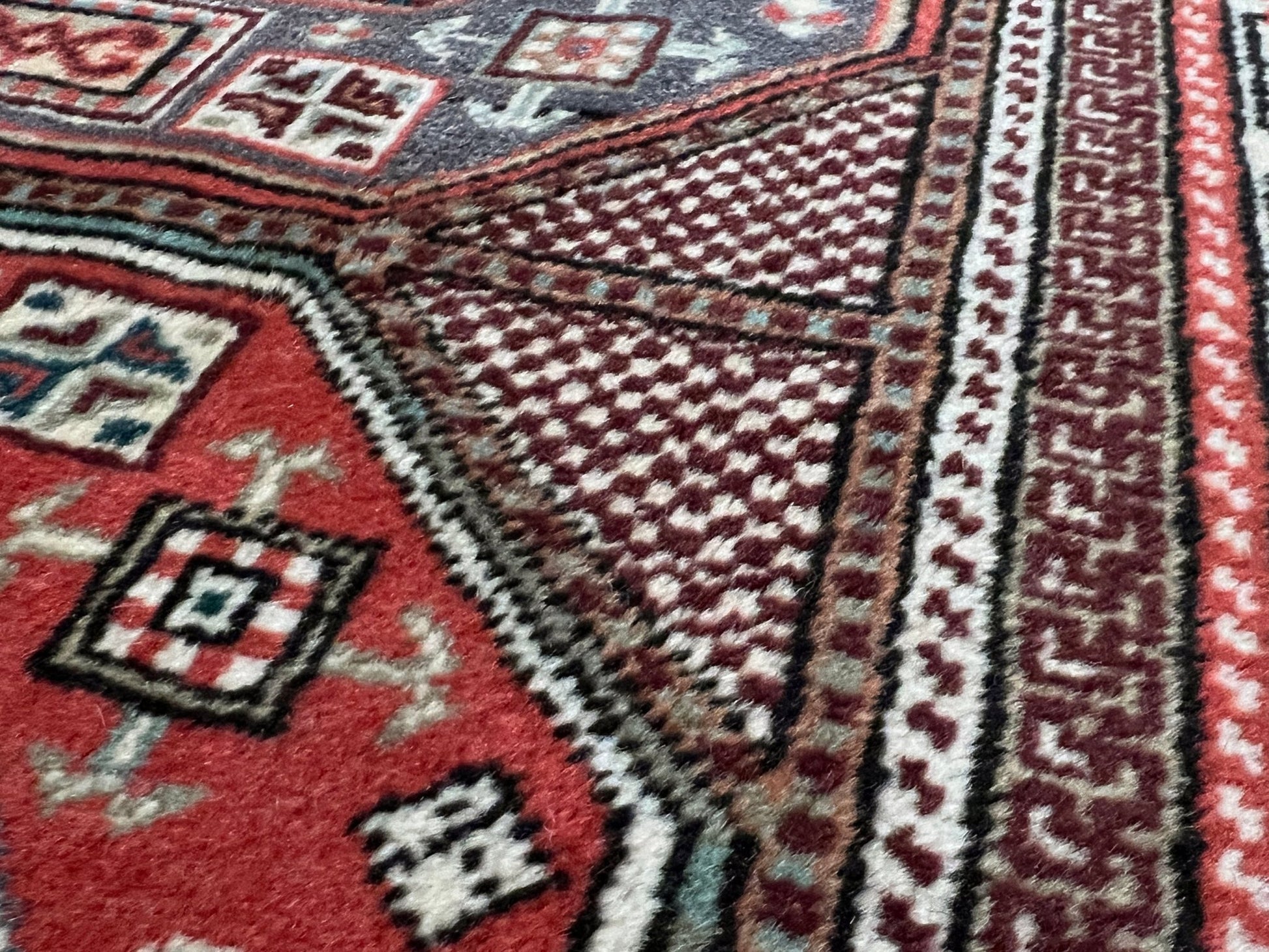 Luxurious 5x7 Turkish tribal rug with geometric 'chest' octagonal medallions and intricate checkered pattern in earth colors. Handmade and available from the best luxury rug shop in the San Francisco Bay Area. Free shipping