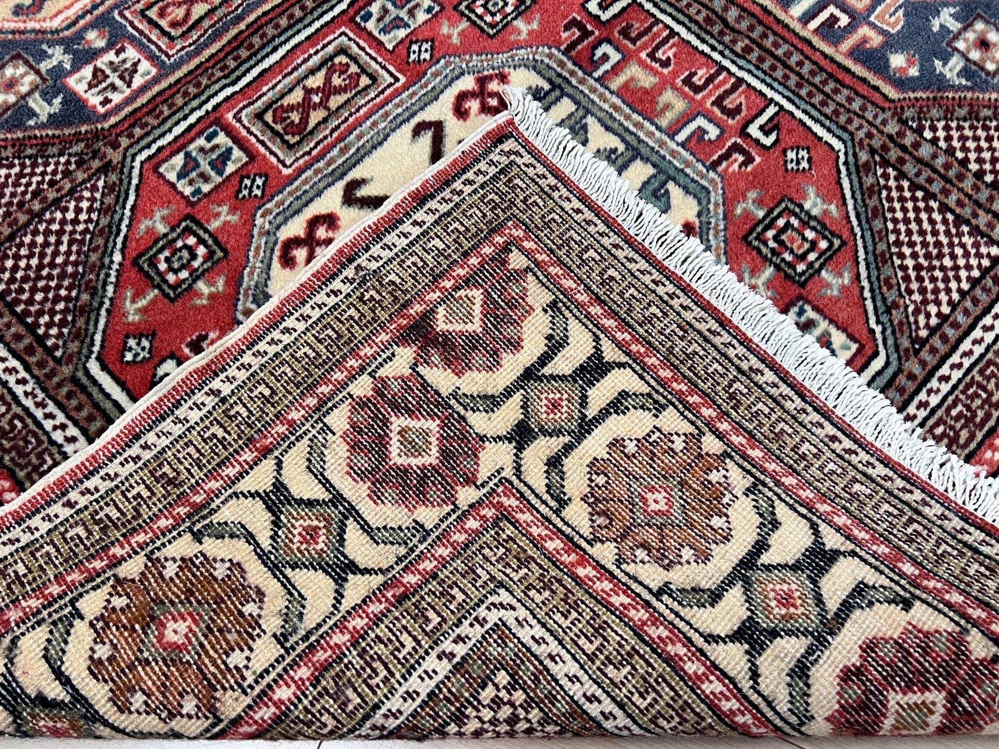 Luxurious 5x7 Turkish tribal rug with geometric 'chest' octagonal medallions and intricate checkered pattern in earth colors. Handmade and available from the best luxury rug shop in the San Francisco Bay Area. Free shipping