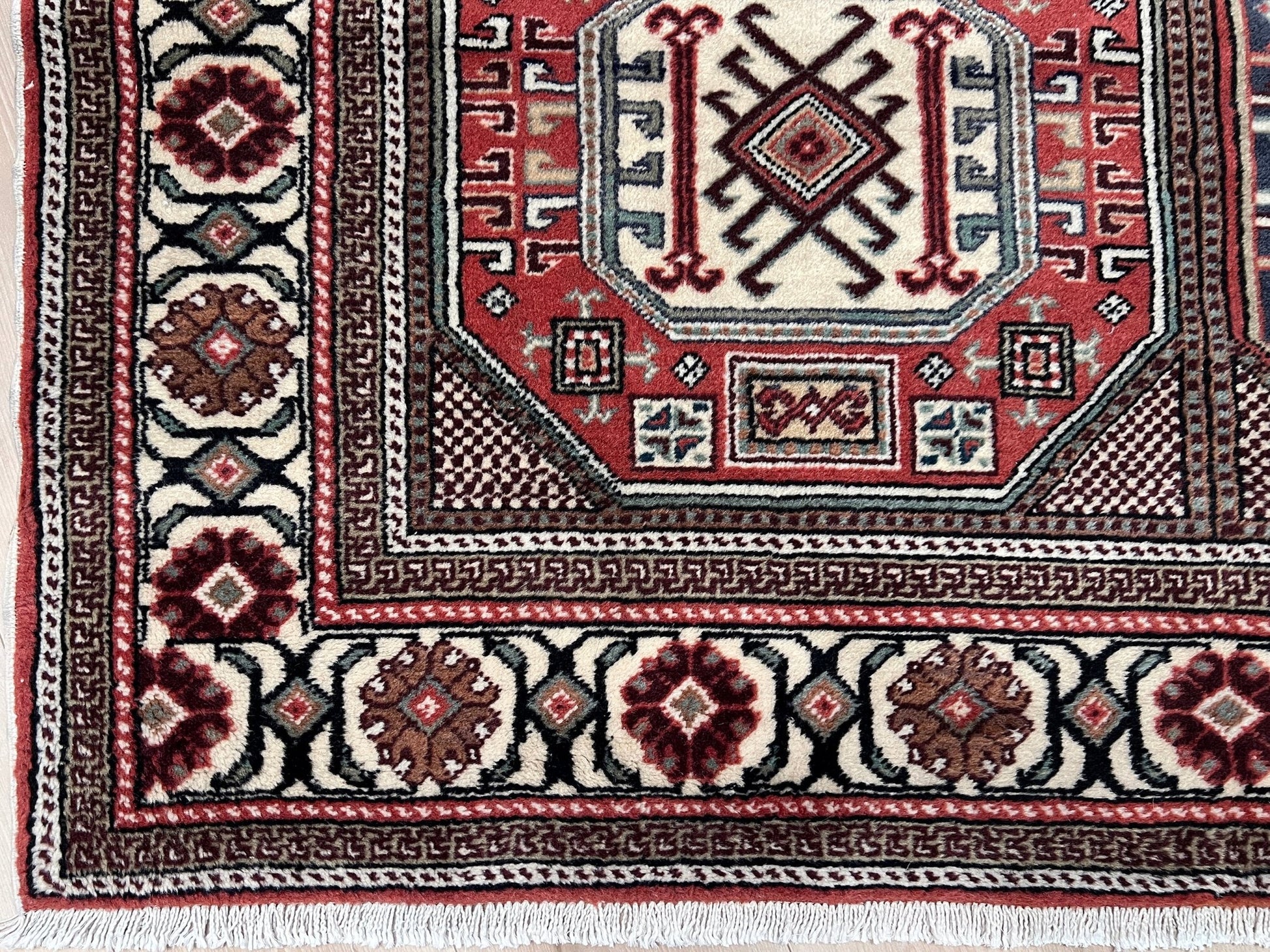 Luxurious 5x7 Turkish tribal rug with geometric 'chest' octagonal medallions and intricate checkered pattern in earth colors. Handmade and available from the best luxury rug shop in the San Francisco Bay Area. Free shipping