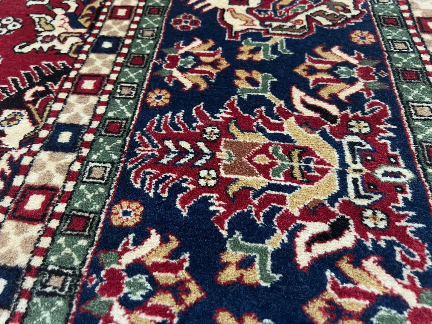 Close up of 8x11 ft Hereke vintage Turkish luxury rug with crown-like floral motifs, perfect for living rooms, bedrooms, or dining spaces. This elegant handmade wool-on-cotton carpet is in pristine condition with authentic 'HEREKE' marking. From the best luxury handmade rug shop in the San Francisco Bay Area, offering free shipping. Add this timeless piece to your home for unmatched sophistication and style.