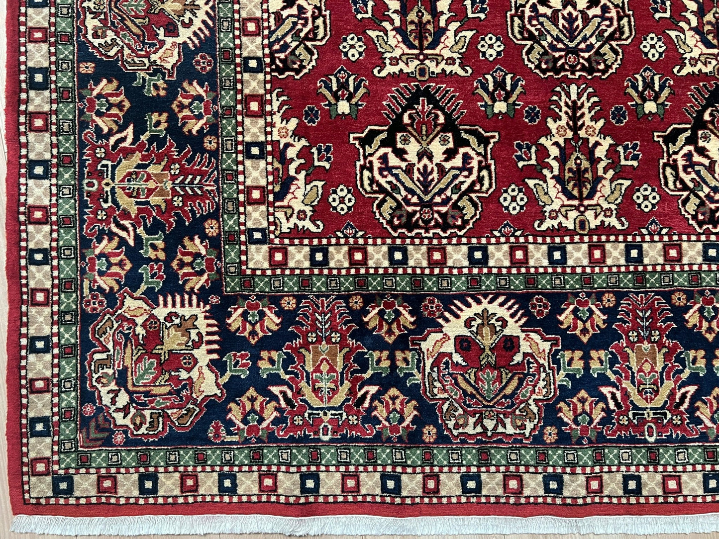 Corner of 8x11 ft Hereke vintage Turkish luxury rug with crown-like floral motifs, perfect for living rooms, bedrooms, or dining spaces. This elegant handmade wool-on-cotton carpet is in pristine condition with authentic 'HEREKE' marking. From the best luxury handmade rug shop in the San Francisco Bay Area, offering free shipping. Add this timeless piece to your home for unmatched sophistication and style.