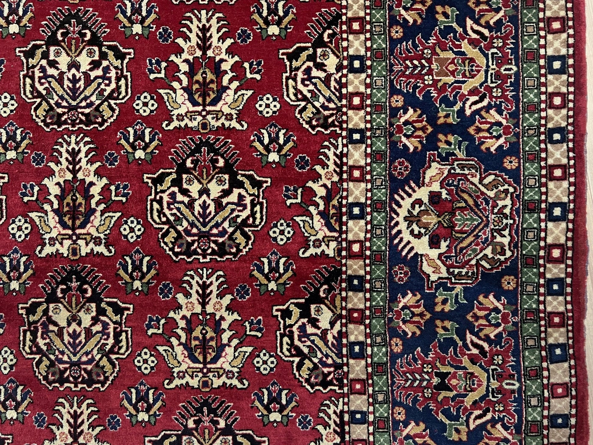 Border of 8x11 ft Hereke vintage Turkish luxury rug with crown-like floral motifs, perfect for living rooms, bedrooms, or dining spaces. This elegant handmade wool-on-cotton carpet is in pristine condition with authentic 'HEREKE' marking. From the best luxury handmade rug shop in the San Francisco Bay Area, offering free shipping. Add this timeless piece to your home for unmatched sophistication and style.