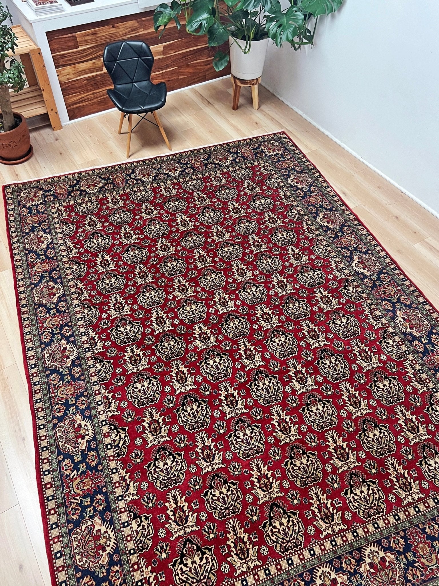 Side view of 8x11 ft Hereke vintage Turkish luxury rug with crown-like floral motifs, perfect for living rooms, bedrooms, or dining spaces. This elegant handmade wool-on-cotton carpet is in pristine condition with authentic 'HEREKE' marking. From the best luxury handmade rug shop in the San Francisco Bay Area, offering free shipping. Add this timeless piece to your home for unmatched sophistication and style.