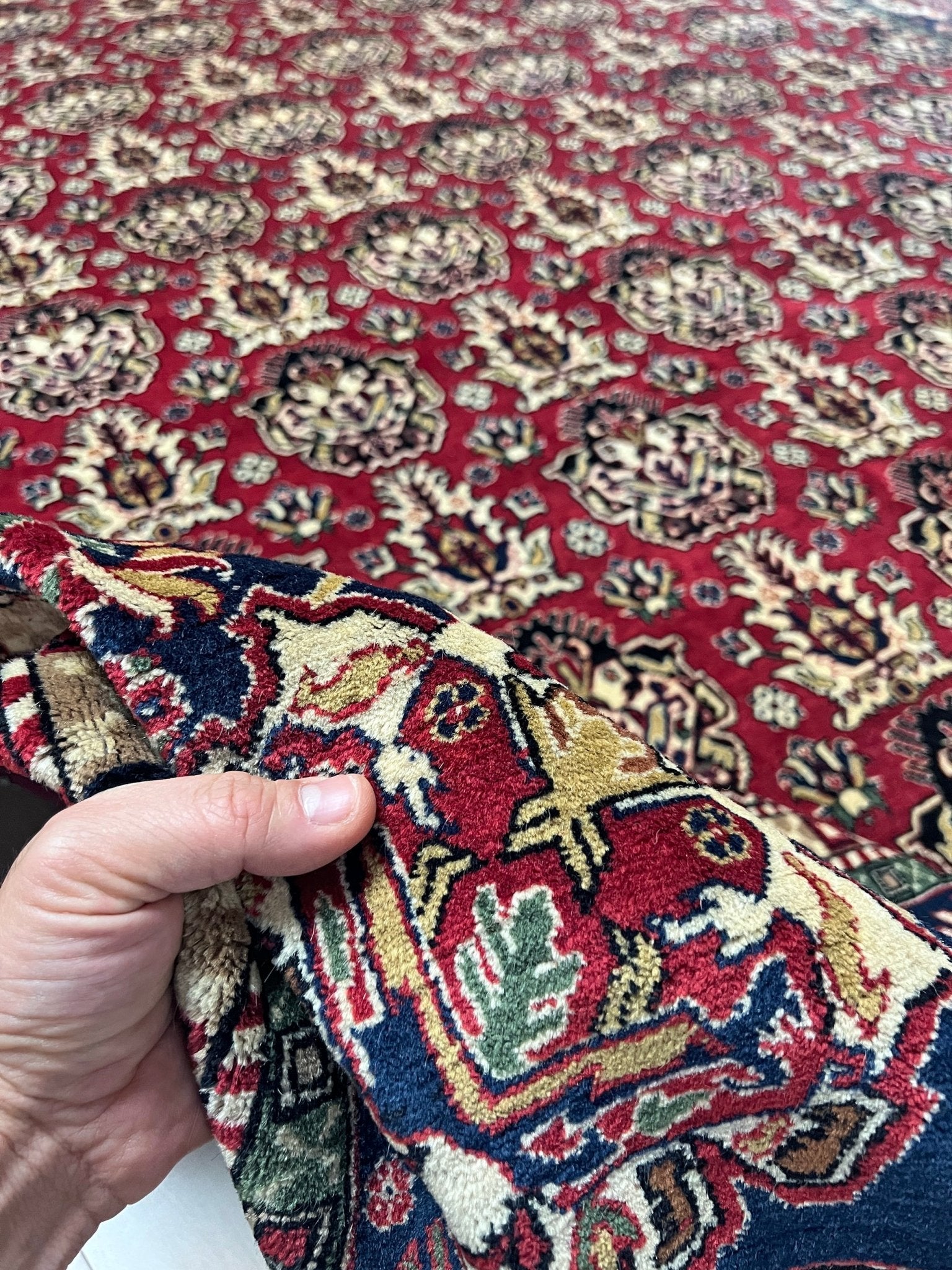 Close up of 8x11 ft Hereke vintage Turkish luxury rug with crown-like floral motifs, perfect for living rooms, bedrooms, or dining spaces. This elegant handmade wool-on-cotton carpet is in pristine condition with authentic 'HEREKE' marking. From the best luxury handmade rug shop in the San Francisco Bay Area, offering free shipping. Add this timeless piece to your home for unmatched sophistication and style.