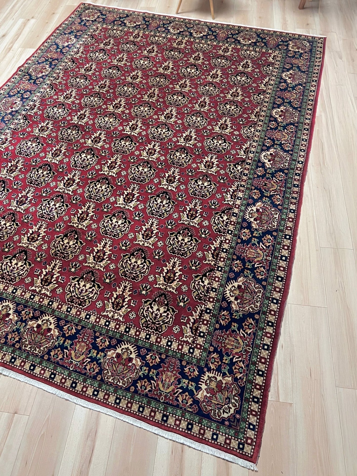 Side view of 8x11 ft Hereke vintage Turkish luxury rug with crown-like floral motifs, perfect for living rooms, bedrooms, or dining spaces. This elegant handmade wool-on-cotton carpet is in pristine condition with authentic 'HEREKE' marking. From the best luxury handmade rug shop in the San Francisco Bay Area, offering free shipping. Add this timeless piece to your home for unmatched sophistication and style.