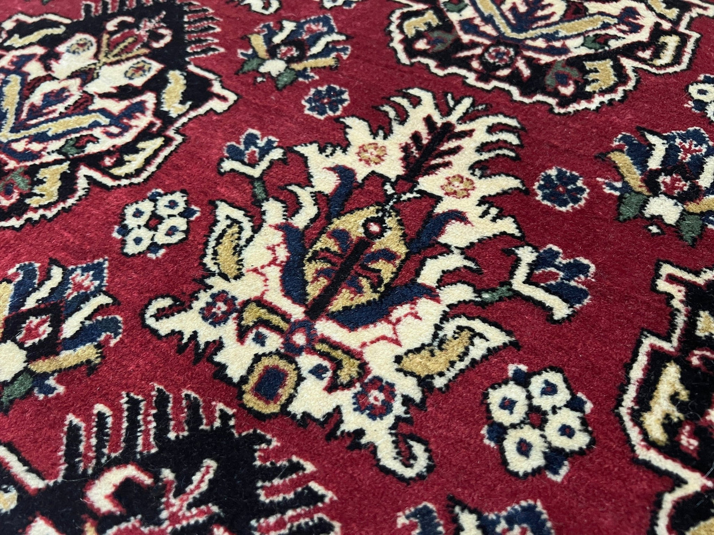 Close up of 8x11 ft Hereke vintage Turkish luxury rug with crown-like floral motifs, perfect for living rooms, bedrooms, or dining spaces. This elegant handmade wool-on-cotton carpet is in pristine condition with authentic 'HEREKE' marking. From the best luxury handmade rug shop in the San Francisco Bay Area, offering free shipping. Add this timeless piece to your home for unmatched sophistication and style.