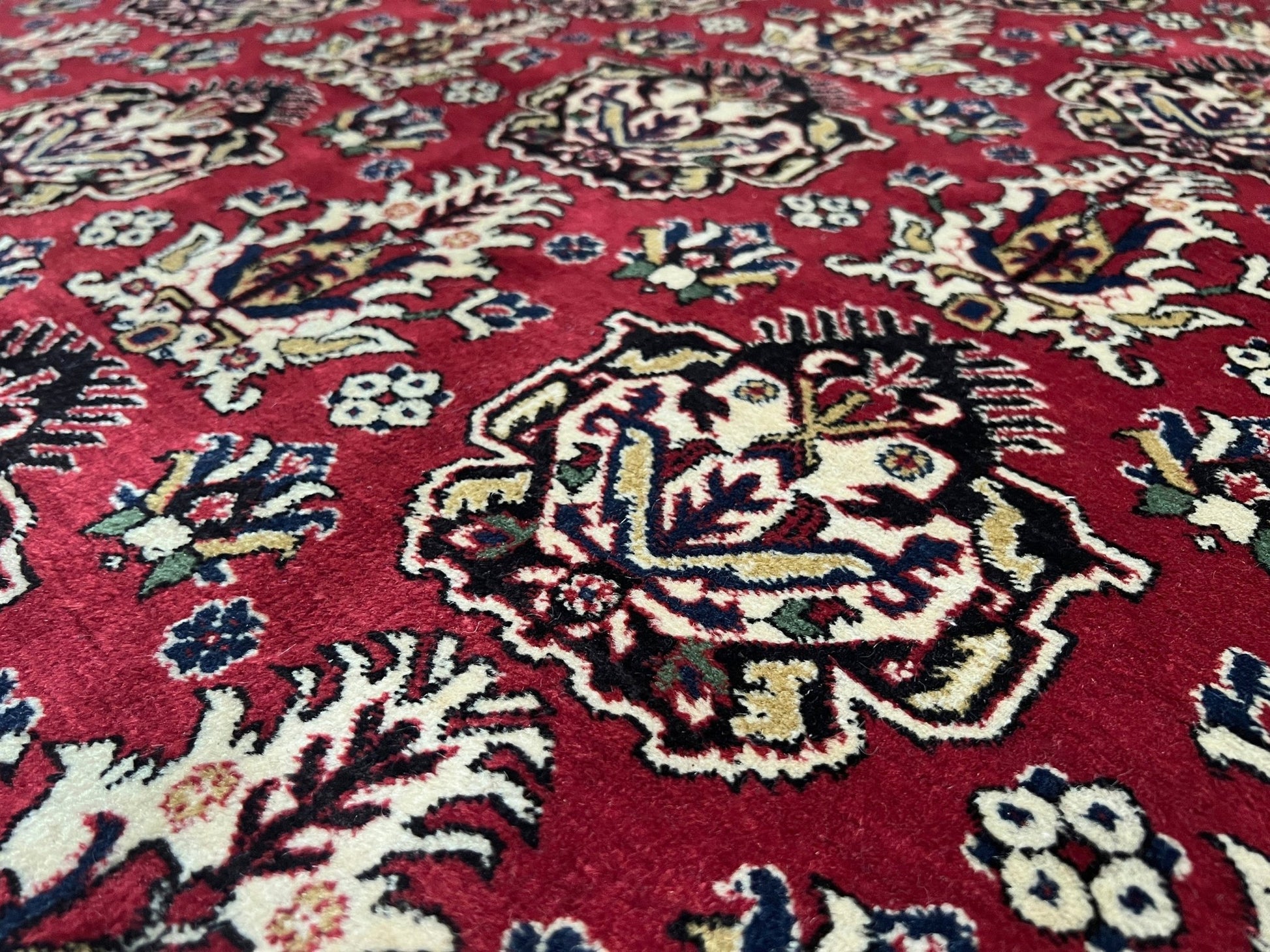 Close up of 8x11 ft Hereke vintage Turkish luxury rug with crown-like floral motifs, perfect for living rooms, bedrooms, or dining spaces. This elegant handmade wool-on-cotton carpet is in pristine condition with authentic 'HEREKE' marking. From the best luxury handmade rug shop in the San Francisco Bay Area, offering free shipping. Add this timeless piece to your home for unmatched sophistication and style.