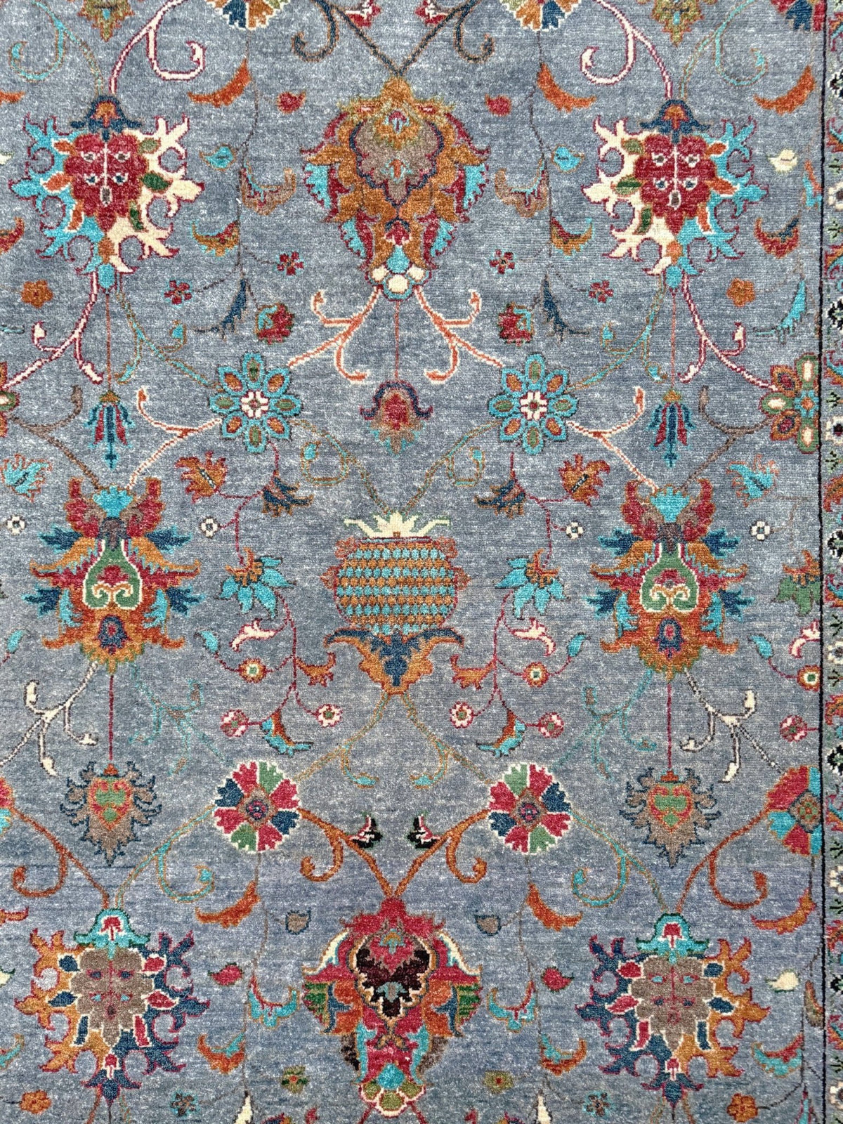 Blue gray Ziegler Turkish rug with floral accents, handmade wool 7x9 area rug from Indigo Rugs Burlingame Bay Area.