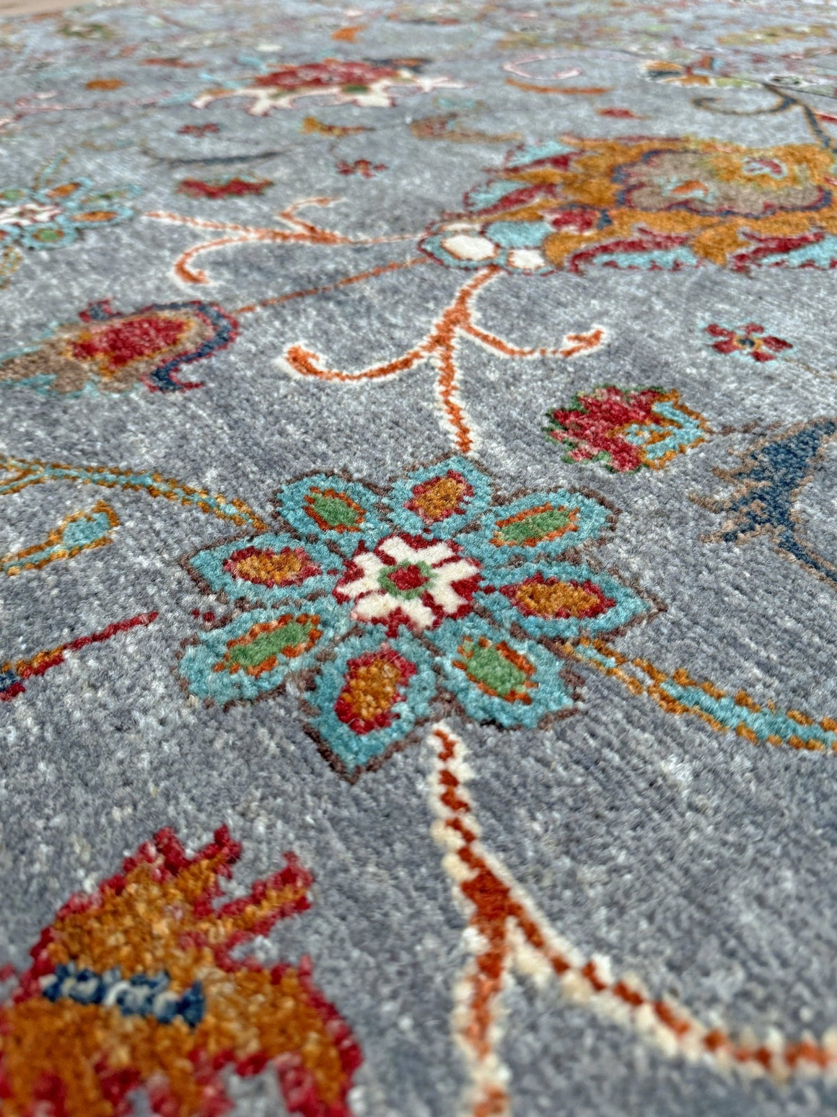 Blue gray Ziegler Turkish rug with floral accents, handmade wool 7x9 area rug from Indigo Rugs Burlingame Bay Area.