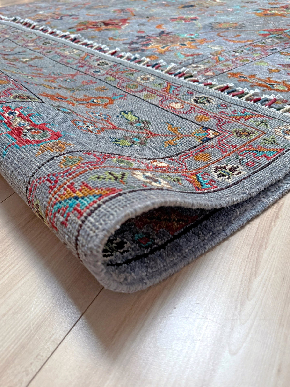Blue gray Ziegler Turkish rug with floral accents, handmade wool 7x9 area rug from Indigo Rugs Burlingame Bay Area.