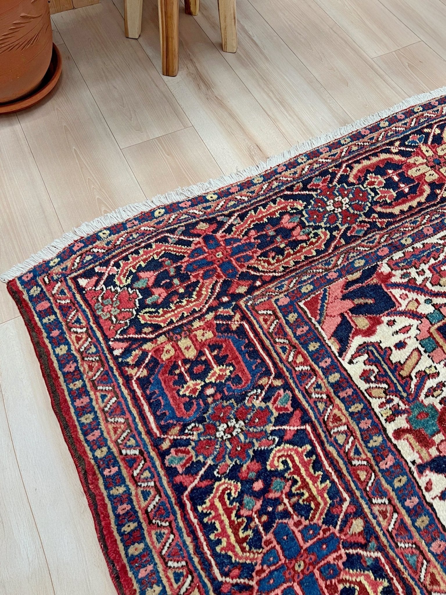 10x14 oversize handmade Persian Heriz vintage rug madder red and navy — shown in living room at Indigo Rugs, Burlingame — San Francisco Bay Area with free shipping