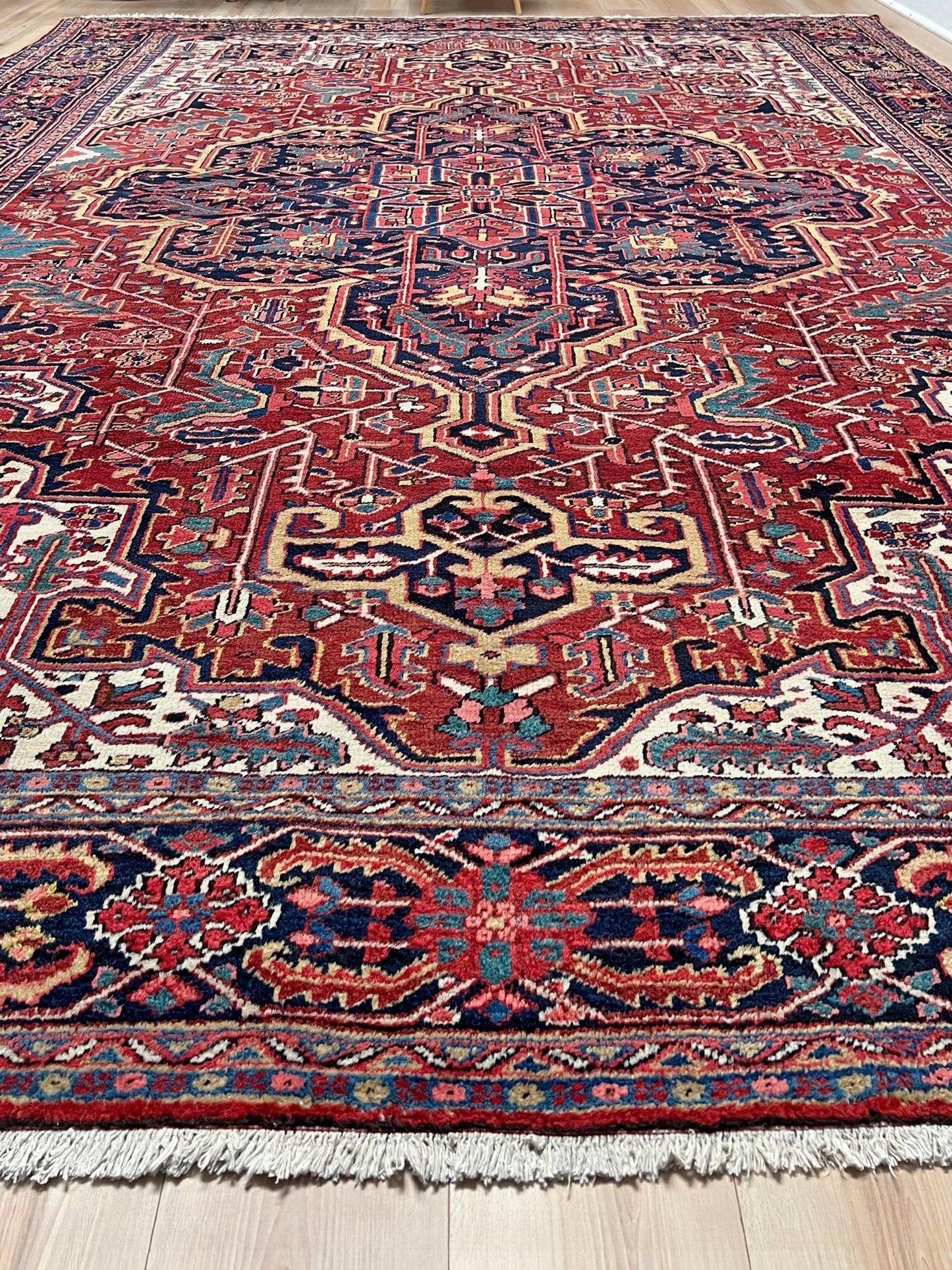10x14 oversize handmade Persian Heriz vintage rug madder red and navy — shown in living room at Indigo Rugs, Burlingame — San Francisco Bay Area with free shipping